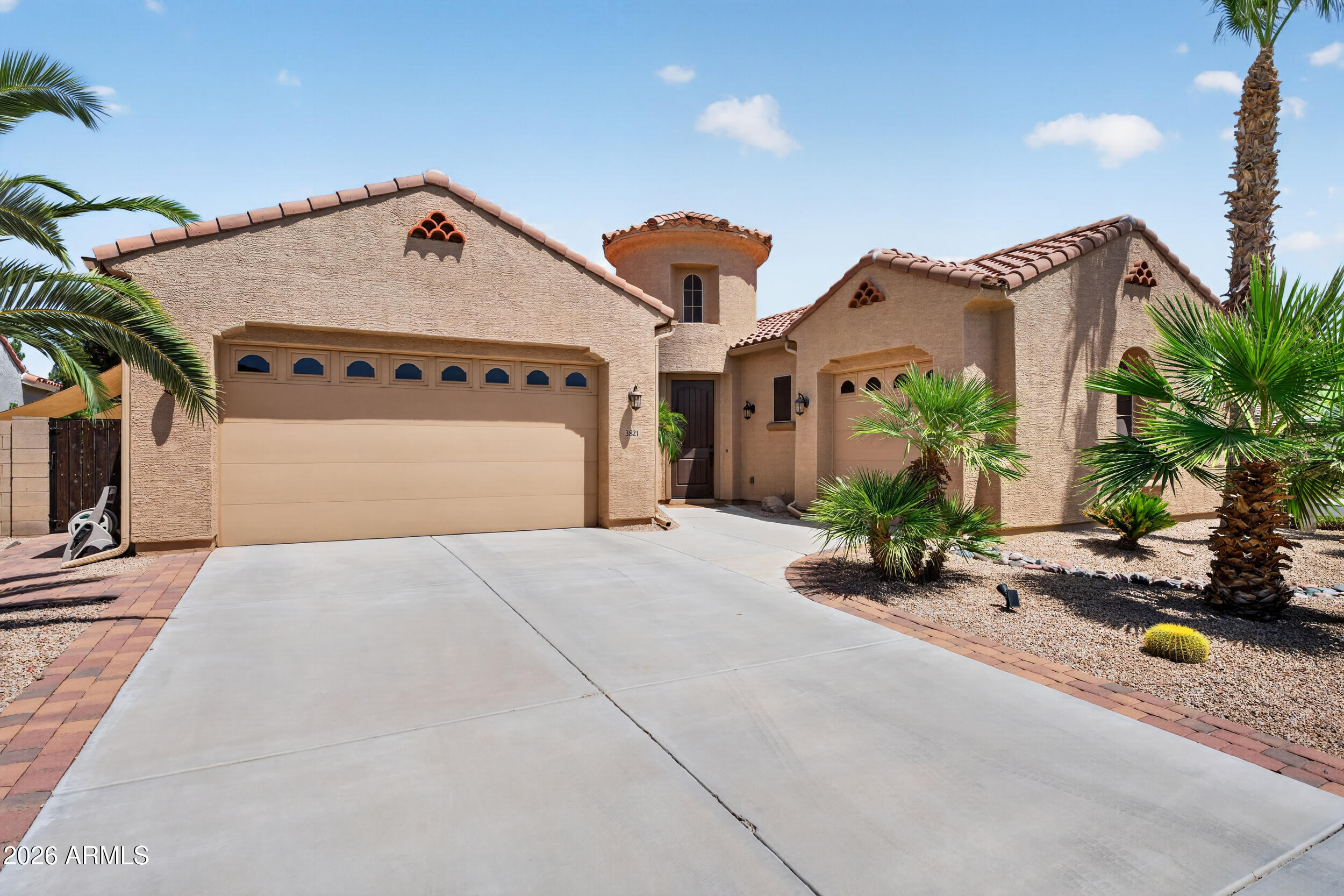 A grand rotunda entry, soaring ceilings, and wide-open living spaces create an immediate sense of scale in this highly sought-after single-story Artesian Ranch home. Set on a premium corner lot with greenbelt adjacency, this 4 bed, 3 bath home with office/den offers 2,706 sq ft, a guest suite with attached bath, chef's kitchen with double ovens and sliding cabinet shelves, plantation shutters, engineered wood and tile flooring, 3-car garage, new HVAC in 2025, and a saltwater pool with solar heating. Lovingly maintained by the original owners, mint condition, move-in ready, and perfectly located in South Chandler south of the 202.