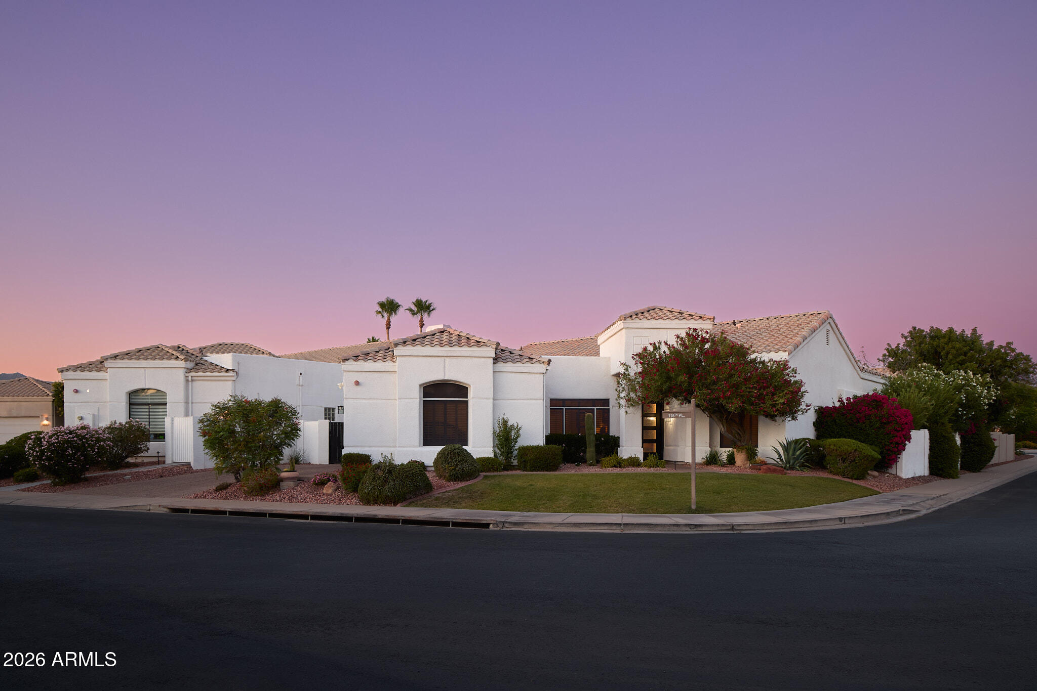 Nestled within the prestigious guard gated community of Stonegate, this fully renovated Scottsdale masterpiece offers the pinnacle of modern living.Chef's kitchen features modern quartz countertops, built in Monogram refrigerator, with a convertible center drawer for refrigerator or freezer use.Two dramatic tri-fold glass doors frame a  central fireplace, creating a seamless indoor/outdoor experience filled with natural light and architectural presence. The resort style  backyard offers a heated waterfall pool,lush desert landscaping, fruit trees and a covered patio designed for elevated dining and entertaining.3 bedrooms ,3 designer baths, including 2 en-suite retreats with spa-level finishes and soaking tub, this home blends comfort,luxury, and the Scottsdale lifestyle in one offering.