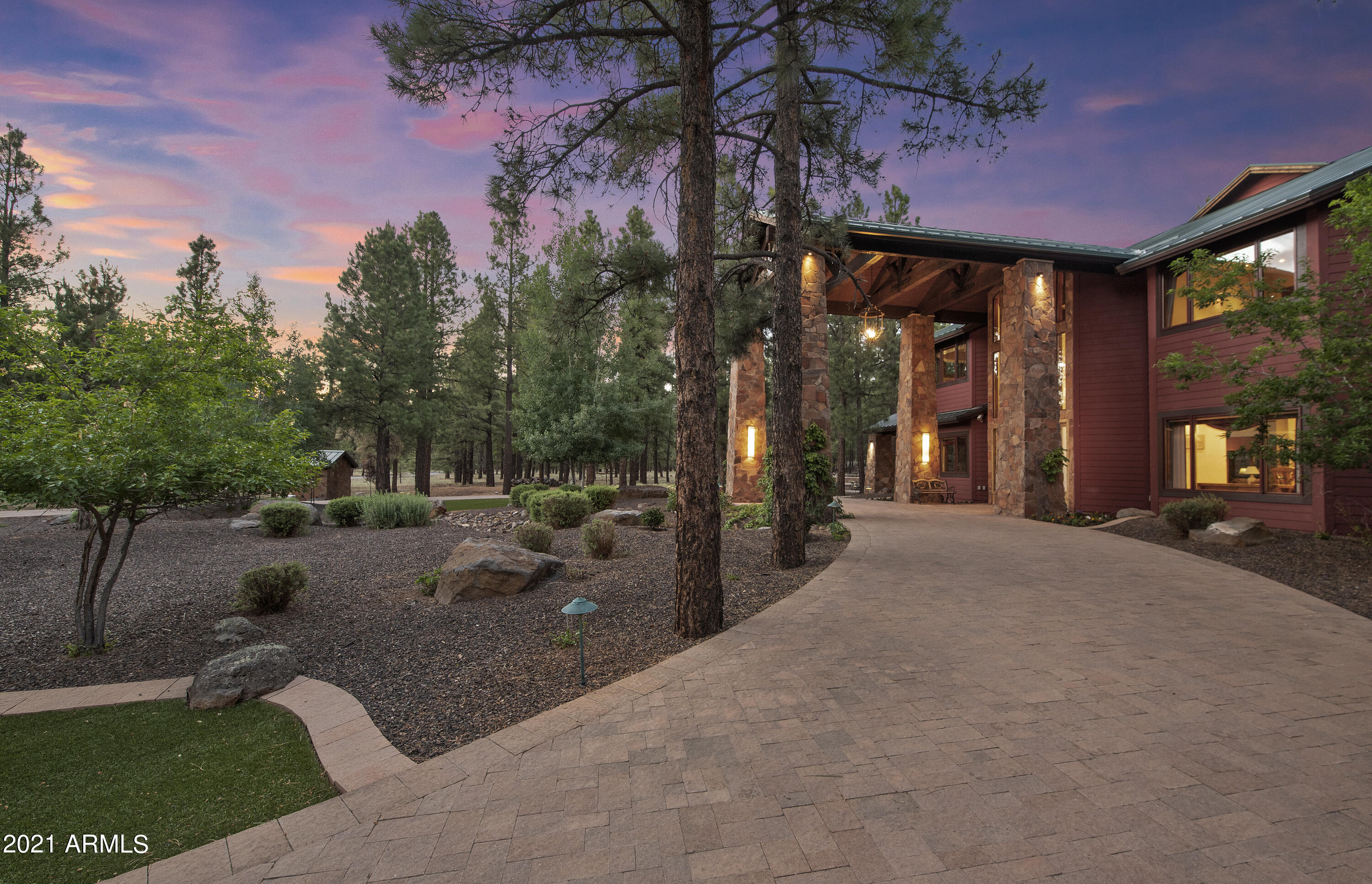 Welcome to Extraordinary in Lockett Ranches. Situated on 6.04 tree covered acres w/ stunning views of San Francisco Peaks, this luxury mountain retreat boasts 7,884 sq.ft., 6 bedrooms + office, 5 full baths, & 2 half baths, two separate living areas, elevator, wine cellar/lounge, home theatre, private well & an oversized 2 car plus RV (40'' depth) garage. The stunning layout is a metaphor for relaxation for the entire family as no detail was overlooked. Luxury is prominent from custom staircase, soaring T & G ceilings & multiple fireplaces. High end appliance package to round out the gourmet kitchen. The variety of covered porches, outdoor patios, pathways, gas firepit & Gazebo provide views of the extensive landscaping & a large pond accented w/ two water features. Thoughtfully designed for a multi-generational lifestyle by the original owner. The photos tell more than any words, so please see the additional photos, attached detail list and Matterport tour.