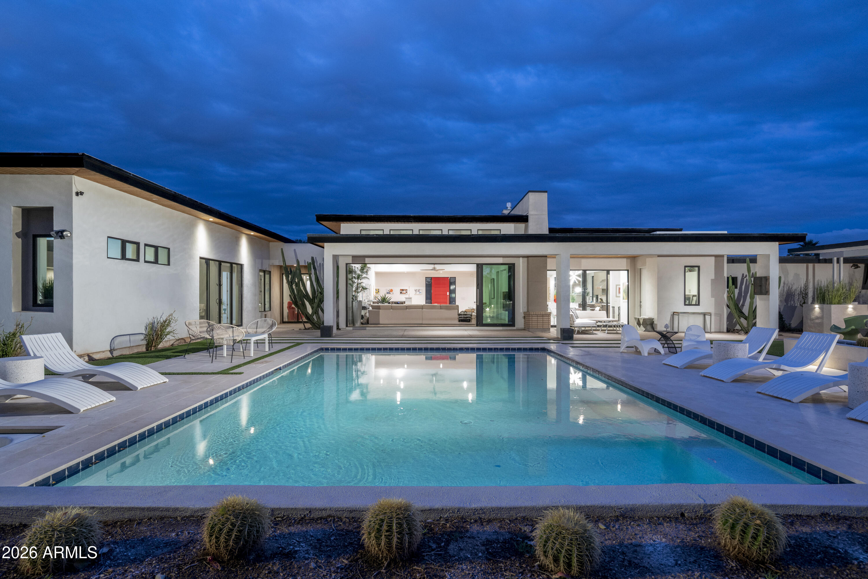 Resort Living in Magic Zip Code! This beautifully designed residence blends modern comfort, spacious living, and seamless indoor-outdoor lifestyle. The open, light-filled floor plan features expansive living spaces, soaring ceilings, and large windows. The chef's kitchen boasts a large island and premium appliances, flowing into the great room--perfect for entertaining. The primary suite offers a spa-inspired bath and generous walk-in closet, with four bedrooms for family, guests, or office space. Step outside to a resort-style backyard with pool, spa, covered patio, and multiple entertaining areas. Minutes from Kierland Commons, Scottsdale Quarter, dining, and golf, this home delivers the ultimate Scottsdale lifestyle.