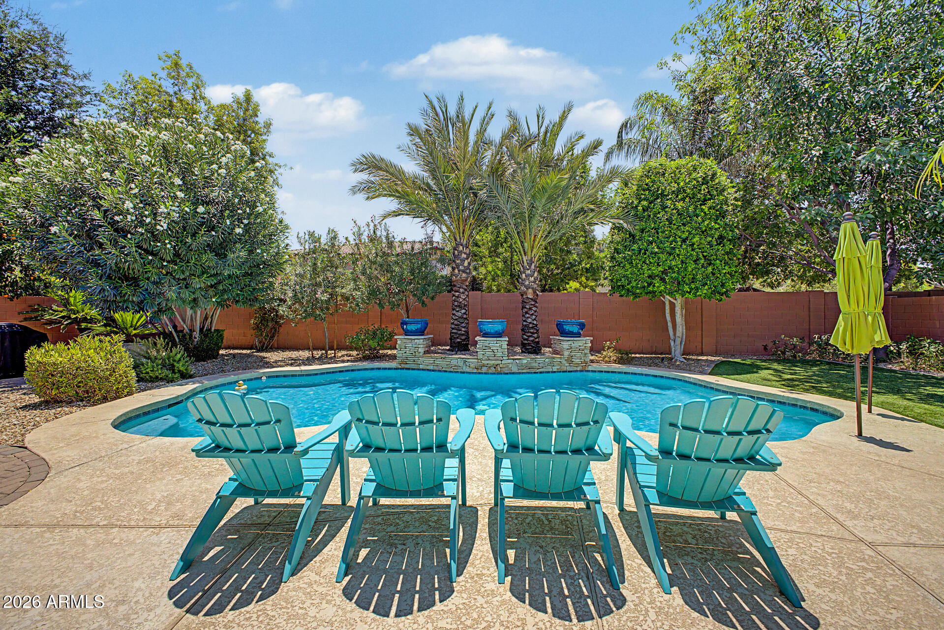 Nestled in an EXCLUSIVE highly sought after gated BOUTIQUE Community of ''JUST 63 RESIDENCES, this beautifully maintained semi-custom home features 3 bedrooms, 2.5 bths, spit floor plan, Den, Family Rm. w/fireplace, Formal Living/Dining & Eat-in Kitchen. Additional highlights incl; 3 car garage w/cabinets & workbench, N/S exposure, plantation shutters, vaulted ceilings, custom two-tone paint, upgraded fans/fixtures & a LARGE PRIVATE lot w/pool & waterfall feature.  The well-appointed Kitchen flows seamlessly into family rm. making it ideal for everyday living & entertaining. Kitchen incl; custom 42'' cabinets, SS appliances, large center island, pantry, & granite countertops. Mstr Bedrm offers executive level vanities, separate tub/shower, large walk-in closet complete w/CUSTOM cabinetry. Step out to your very own backyard oasis featuring a sparkling pool w/water feature, large covered patio, paver walkways, MATURE LUSH landscape and more..truly a backyard paradise. NEW HVAC, see doc section for list of updates. Enjoy the charm, security and sense of community that come with living in this intimate highly sought after neighborhood.