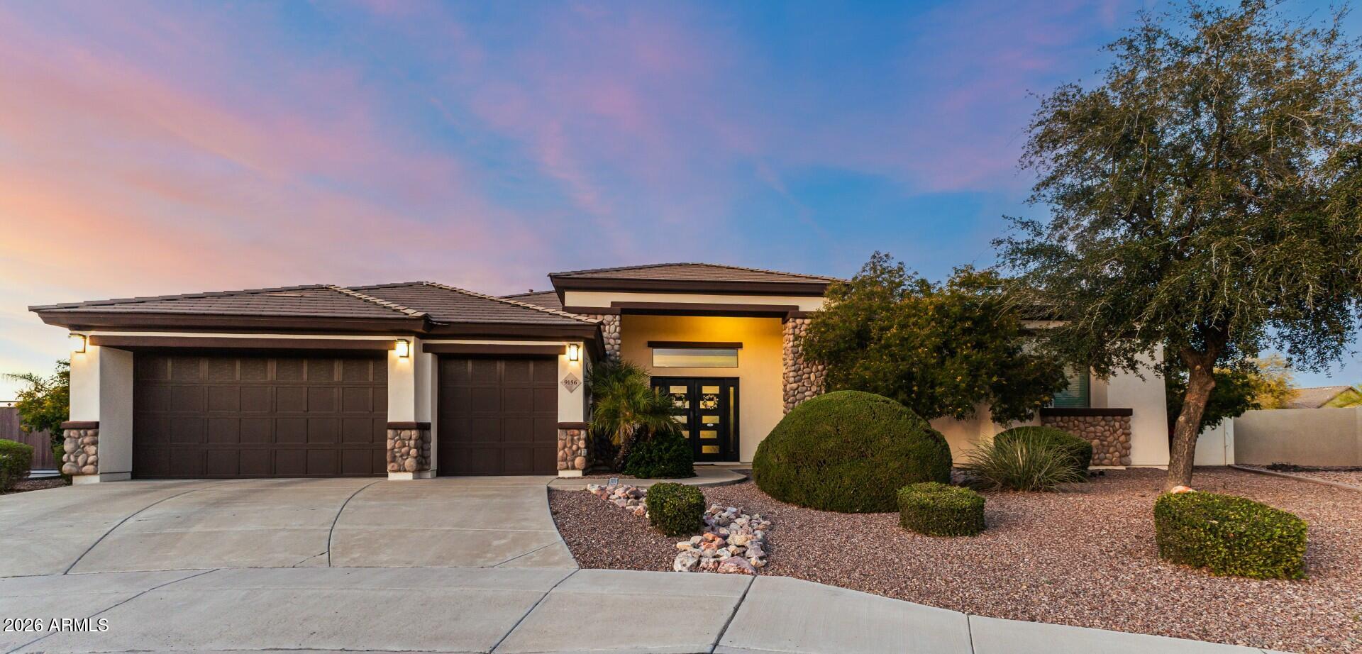 Private 3/4-acre cul-de-sac estate with panoramic mountain views &  a 1,200 sq ft detached guest residence. Designed for elevated Arizona living, backyard is a true retreat-resort-style heated pool, covered patio w/built-in TV wall & separate firepit lounge ideal for entertaining. The 4-bedroom plus office main house offers soaring ceilings, abundant natural light, designer lighting,  fireplace & an entertainer's great room. Remodeled gourmet kitchen features granite counter, waterfall island, custom cabinetry, tile backsplash & premium stainless appliances. The guest house includes 2 bedrooms, 2 baths, full kitchen, living & dining areas & private laundry-ideal for multigenerational living or executive office use. Electric RV Gate & 3-car garage complete this North Peoria Rare Retreat!!
