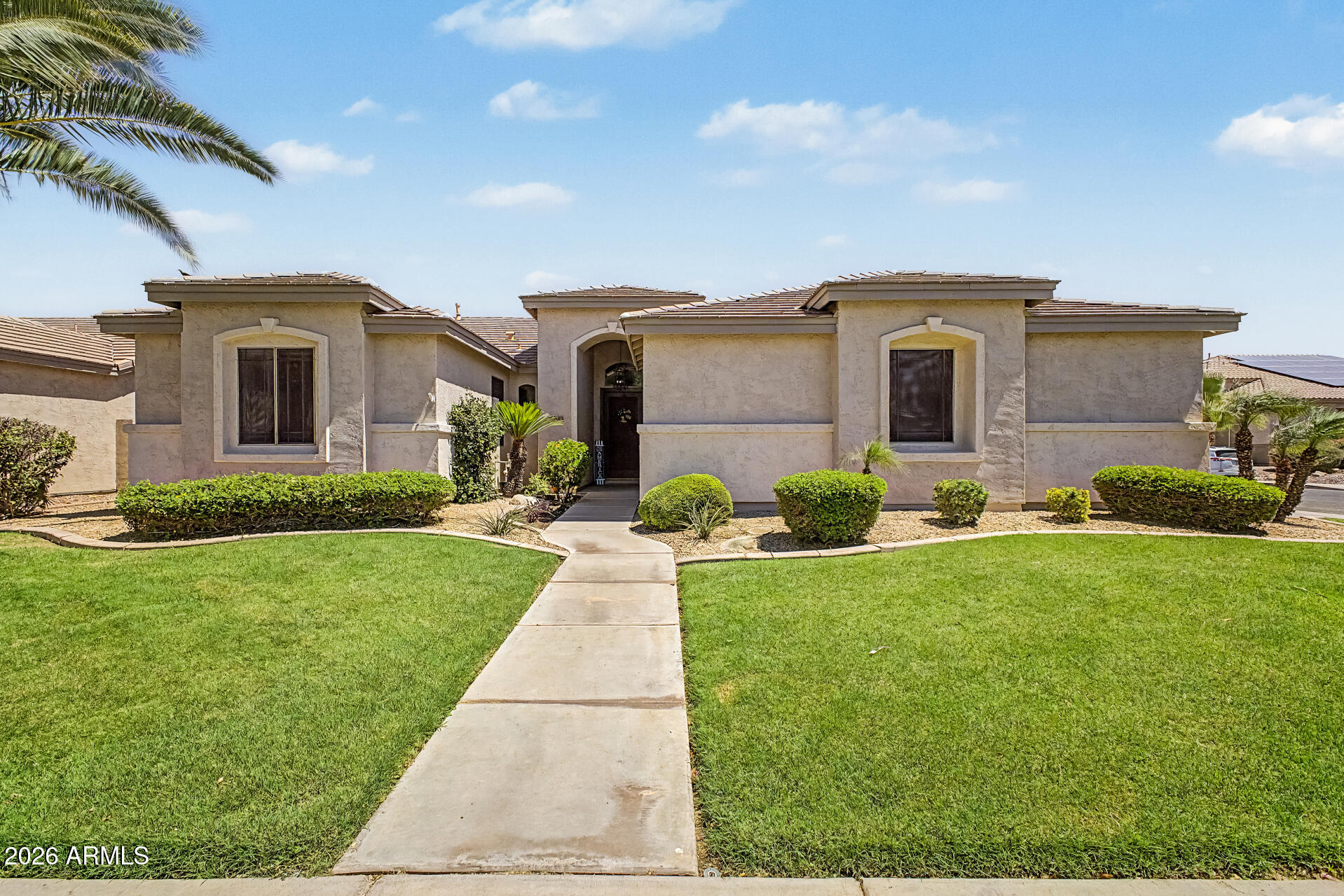 Your dream corner lot home is finally here! You're welcomed w/ a manicured lawn, a 2-car garage, & an RV gate. Fall in love w/ the spacious formal living/dining room boasting high ceilings, abundant natural light, a soothing palette, attractive tile flooring, & a cozy family room for entertaining or relaxing with family. The impeccable kitchen comes w/ solid surface counters, crisp white cabinets, pendant/recessed lighting, a tile backsplash, stainless steel appliances, a pantry, & an island w/ a breakfast bar. Double doors lead to a bedroom/office or study. The primary bedroom showcases a sitting nook, direct backyard access, an ensuite w/ dual sinks, & a walk-in closet. The enchanting backyard features a covered patio, lush natural turf, & a refreshing pool. Make this gem yours!