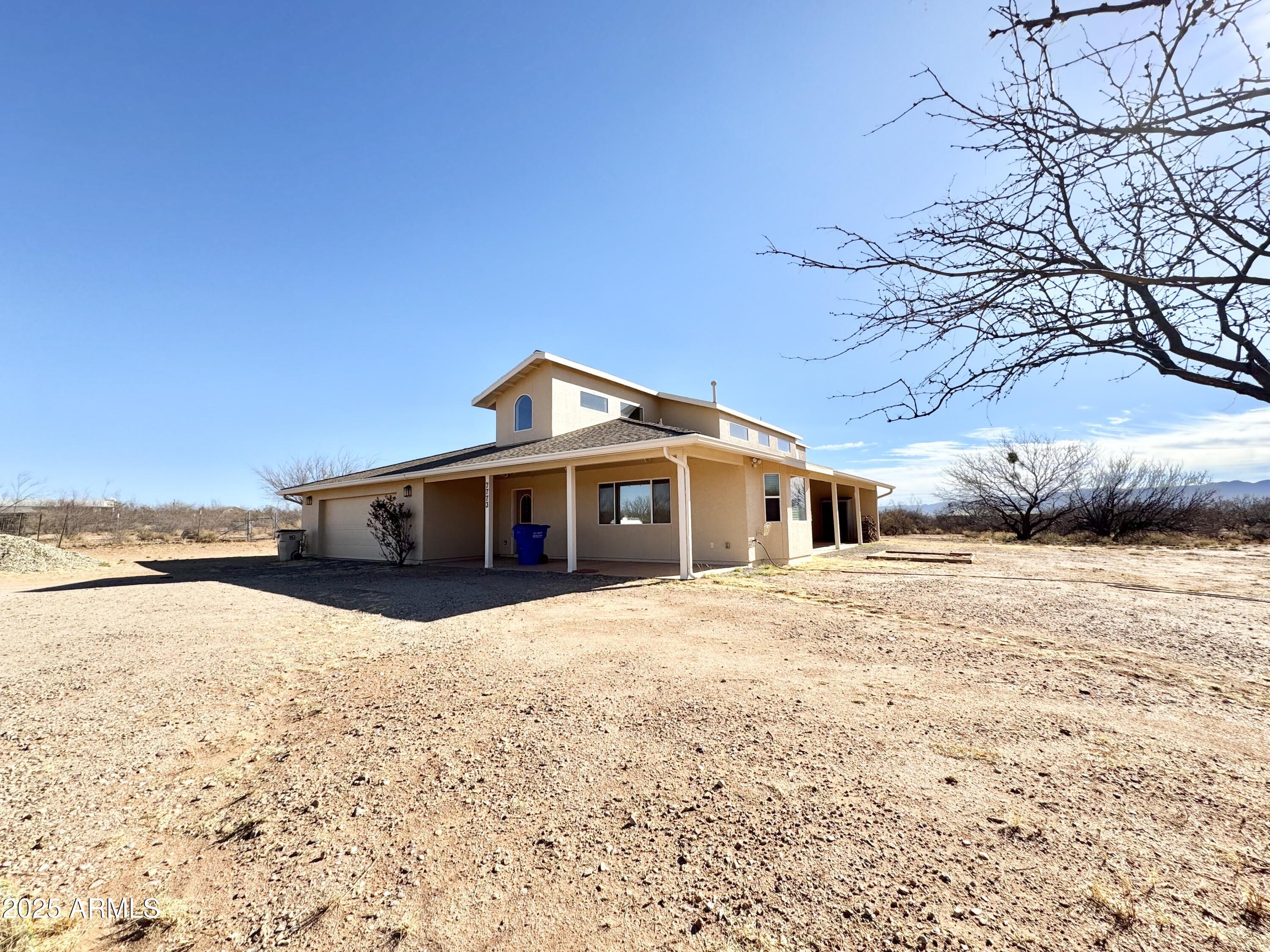 Welcome to this stunning 5-bedroom, 3-bathroom home with a large 2-car garage, set on a sprawling 4.7-acre lot in scenic Sierra Vista, AZ. Built in 2006, this spacious 3,545 sq ft residence blends modern comfort with country charm. The well-appointed kitchen boasts hickory cabinets and essential appliances, while a wood-burning fireplace adds warmth. Each bedroom features a walk-in closet, and a big laundry room provides extra convenience. Central heating and air, with three separate propane-fueled zones, ensure year-round comfort, along with two propane water heaters. Enjoy breathtaking mountain views on a horse-friendly property. A private well adds self-sufficiency, and with no HOA, you have the freedom to make this property your own. Don't miss this exceptional home!
