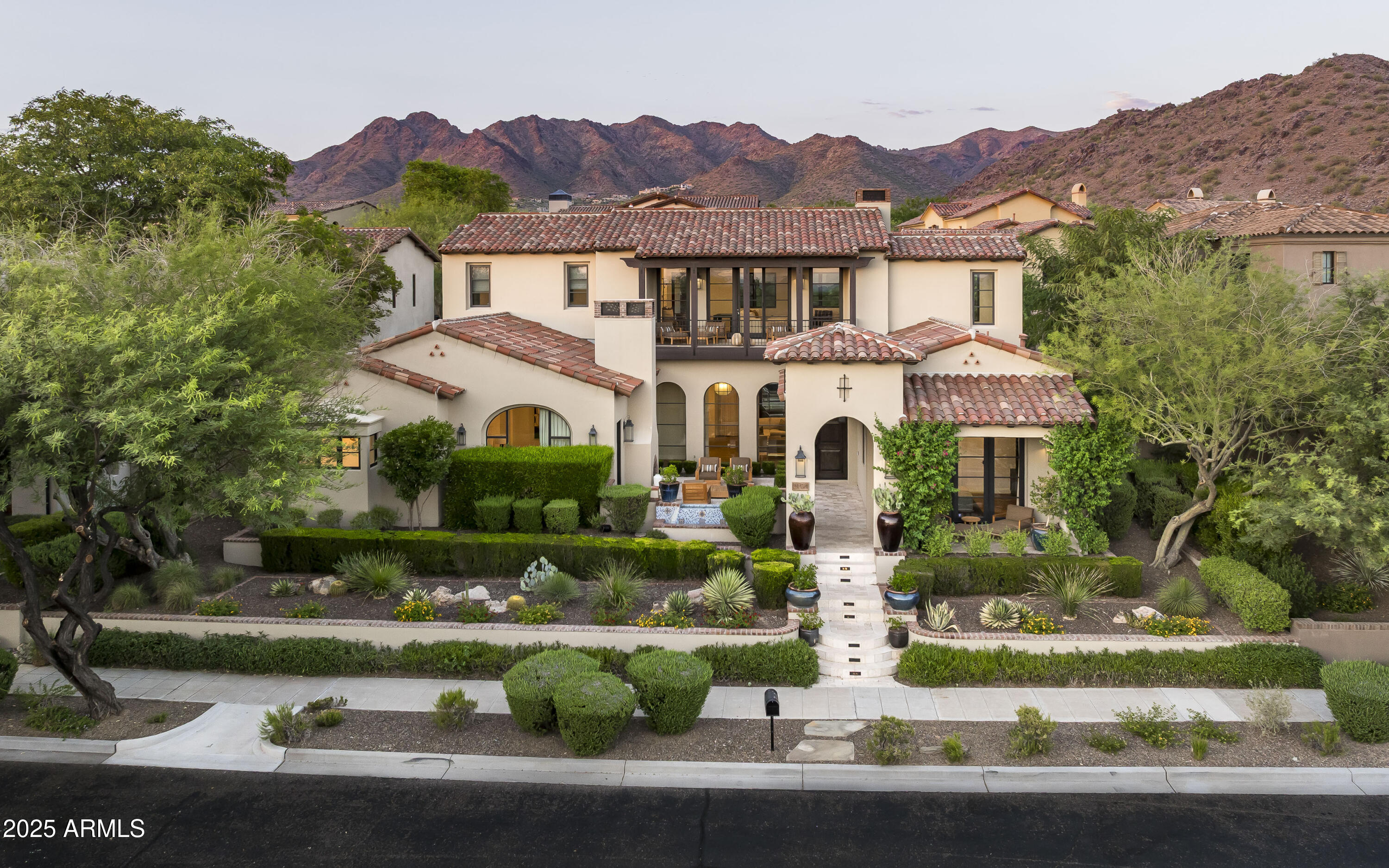 Set against the scenic backdrop of Arizona sunsets and McDowell Mountain views, this beautifully updated custom residence in The Parks at Silverleaf offers an elegant blend of luxury, privacy, and effortless style. Thoughtfully designed with timeless finishes and inviting spaces, the home captures the essence of refined desert living.
Inside, a chef-worthy kitchen takes center stage with custom cabinetry, top-tier stainless-steel appliances, and an open layout that seamlessly supports both entertaining and everyday life. The main-level primary suite is a true retreat—featuring a cozy stone fireplace, spa-like bathroom, expansive walk-in closet, and direct access to the peaceful front courtyard. All secondary bedrooms include their own en-suite baths, with two additional powder rooms for added flexibility.
Oversized sliding doors open to a resort-inspired backyardcomplete with a covered patio, a built-in Wolf BBQ beneath a charming pergola, multiple lounging areas, and a sparkling pool and spa with tranquil water features. Upstairs, a spacious loft offers a perfect flex space for a game room, home office, or media lounge and opens to a private terrace with panoramic city and mountain views.
Whether you're seeking a seasonal escape or a full-time residence, this home pairs relaxed sophistication with the prestige of one of North Scottsdale's most coveted neighborhoods. Coming to market soondon't miss the opportunity to experience it first.

Silverleaf, located in North Scottsdale, Arizona, is a prestigious guard-gated community known for its luxurious estates, exclusive golf courses, private Club, and stunning desert landscapes. The Tom Weiskopf-designed Silverleaf Golf Course is a highlight for golf enthusiasts. With a blend of Spanish and Mediterranean-inspired architecture, the community offers a high standard of living, including upscale amenities like spas, fine dining, and exclusive shopping. Residents enjoy a harmonious balance between modern luxury and the natural beauty of the desert environment, making Silverleaf a sought-after destination for those seeking an exceptional lifestyle in North Scottsdale.