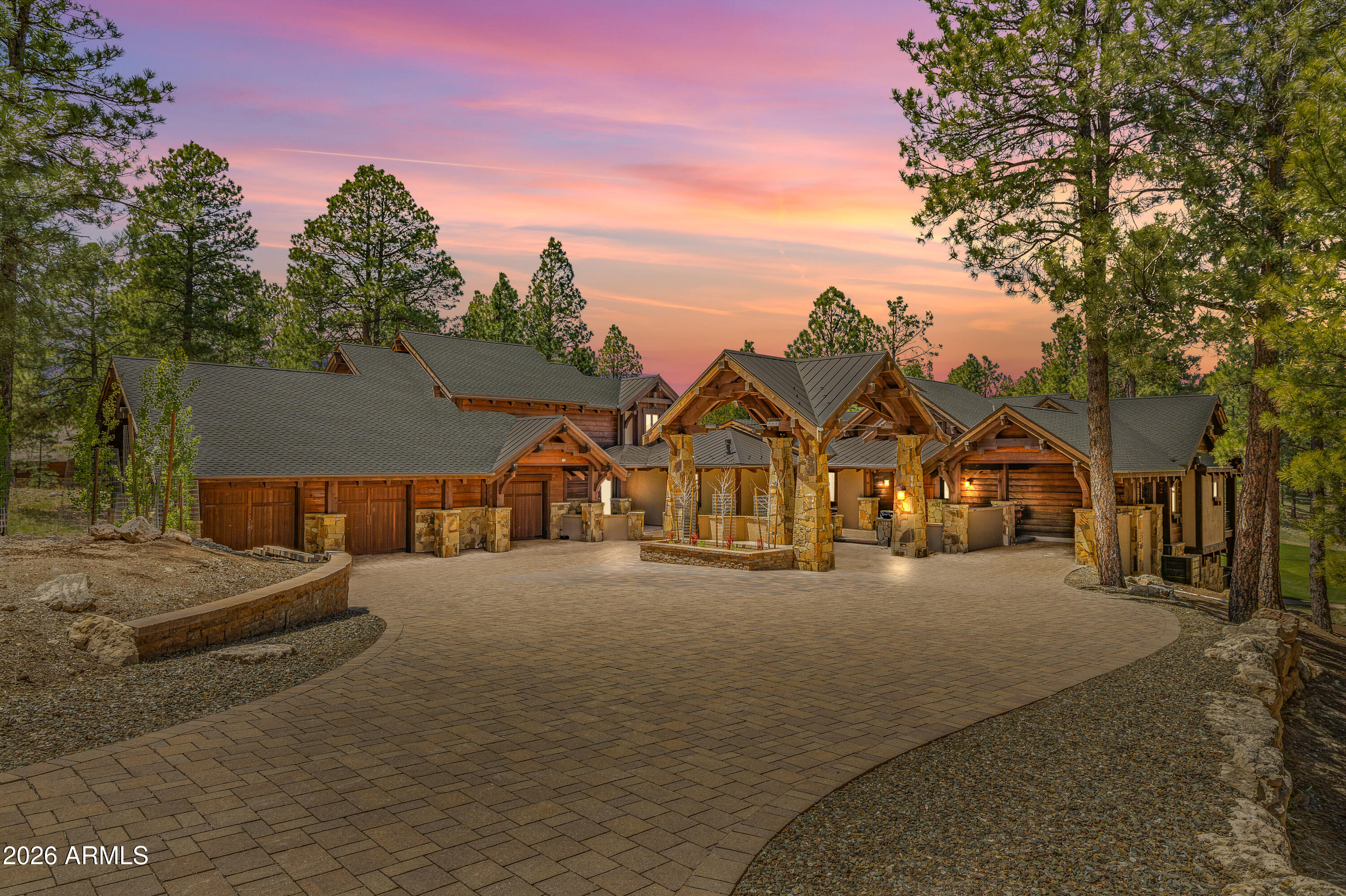 Absolutely fabulous for gathering, entertaining, and multigenerational living, this extraordinary Pine Canyon estate brings together timeless mountain elegance and beautiful craftsmanship. Set on a rare one-acre homesite with sweeping views of the 6th green, this 6,669-square-foot custom home was designed by Scott Wilkinson and built by the renowned Builder's Showcase with privacy and grand-scale living in mind. Arrive beneath the graceful porte-cochère and enter the impressive greatroom that opens to panoramic golf course views. Beamed ceilings, rich architectural details, an artfully designed bar and effortless indoor-outdoor living are elegant enough for a formal evening with friends, yet comfortable and inviting enough for family and long stays in the mountains. Whether you are hosting a dinner party or having fun after an afternoon of golf, the layout works beautifully. 

The chef's kitchen sits perfectly between the formal dining room and the family room, making it easy to cook, host and enjoy time together. 

Expansive decks extend the living space outdoors, offering peaceful morning coffee, sunset cocktails, and unforgettable evenings overlooking the fairway.

The main-level primary suite is a private retreat with quiet deck access and beautiful views in every season. 

Upstairs, the expansive guest suite with its own deck and kitchenette is like a private residence within the home, ideal for extended family, visiting friends, or multigenerational living.

The lower level is made for fun, relaxation, and unforgettable time together. A spacious family room with a bar and stunning golf course views gives everyone room to relax, watch the game, and simply enjoy being together. 

Three additional ensuite bedrooms, each with golf course views, offer exceptional privacy and comfort for family and guests. The theatre room adds another layer of enjoyment, creating the perfect place for movie nights, sleepovers, and evenings after a full day in Pine Canyon.

Rare in scale, rich in character, and beautifully suited for entertaining, this Pine Canyon legacy estate is more than a luxury home. It is a place to live beautifully and create the kind of memories that last.