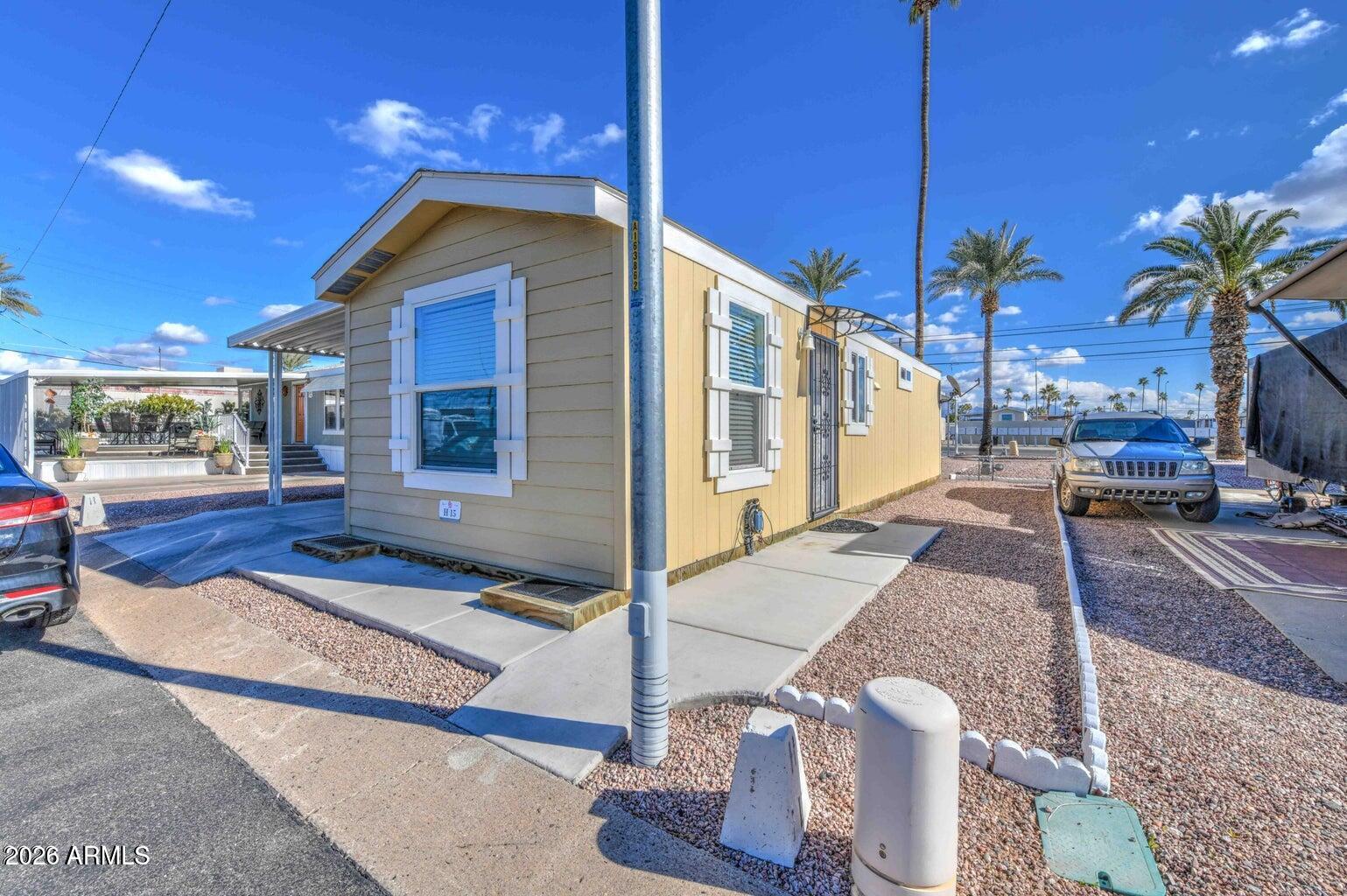 : You don't want to miss this one! 2020 Cavco- No Steps No Stairs! Ground Mounted 1 bed, 1 bath, with 8x8 Laundry storage and
Washer/Dryer included. Natural Gas Oven/Range and Furnace, with Dishwasher Microwave and Matching Fridge. Quaint Gated 55+ Community
Conveniently located in East Mesa. Move in Ready!