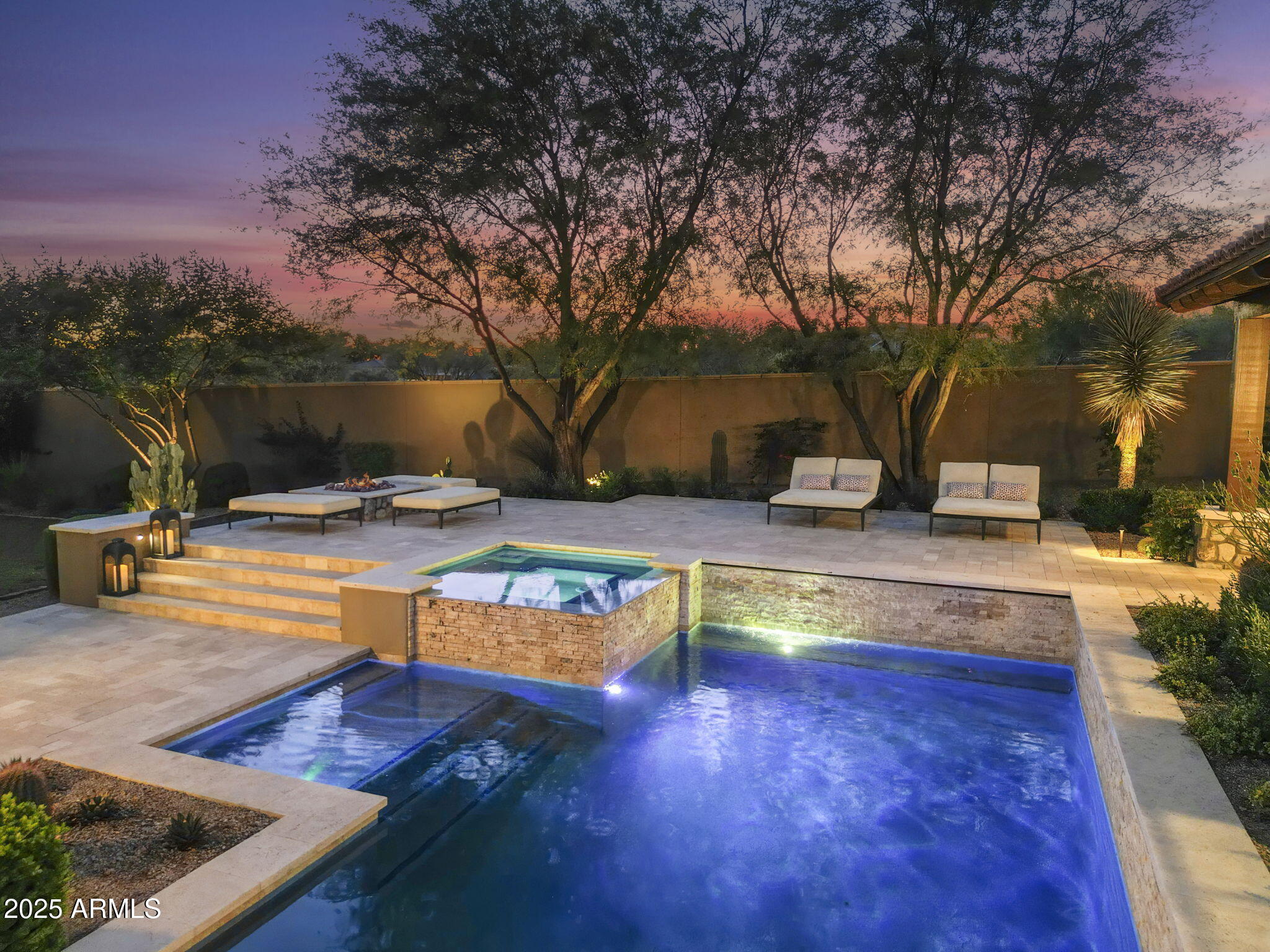 Experience the refined luxury desert living in this extraordinary 5,239 square-foot, single-story Ranch Hacienda, perfectly situated on a mature tree-lined quiet cul-de-sac lot in the highly desired guard gated Horseshoe Canyon neighborhood of Silverleaf, just moments from the exclusive Silverleaf Club and four beautiful parks. Crafted by renowned builder GS Fries Construction, this rare newer-built opportunity blends timeless southwest architecture with modern sophistication and luxurious functionality. Step inside to discover a spacious, light-filled floor plan offering 6 En-suite bedrooms and 6 ½ bathrooms, including an opulent primary suite with a spa-inspired bath ultimate relaxation and privacy. A dedicated kids' wing complete with a roomy bonus space provides ample flexibility for family living and a detached 522-square-foot one-bedroom casita is ideal for guests, extended family, or a private studio retreat.  At the center of the home, a gourmet chef's kitchen showcases Wolf & Sub-Zero appliances, Quartz Counters, two dishwashers, two disposals, custom cabinetry, and designer finishes thoughtfully designed for both everyday living and elegant entertaining. The inviting Great Room flows seamlessly to a beautifully landscaped backyard, ideal for gatherings and tranquil moments alike. In the family room, a stylishly integrated wine fridge is perfect for effortless entertaining and casual enjoyment.
Beyond the interiors, the resort-inspired outdoor oasis features a heated pool and spa, a cozy fire pit, a grassy area and panoramic views stretching across the McDowell Mountains, Camelback Mountain, and the sweeping Sonoran sunsets. An oversized three-car garage offers built-in cabinetry, epoxy flooring, and two EV charging stations, delivering exceptional convenience and modern style.
This is truly a unique opportunity to own a newly constructed custom home in one of Scottsdale's most coveted communities where no detail was missed! This estate is crafted for the most discerning homeowners seeking the pinnacle of desert luxury living. Ideally located to Scottsdale's finest dining, shopping, schools and conveniently located to the 101 freeway.