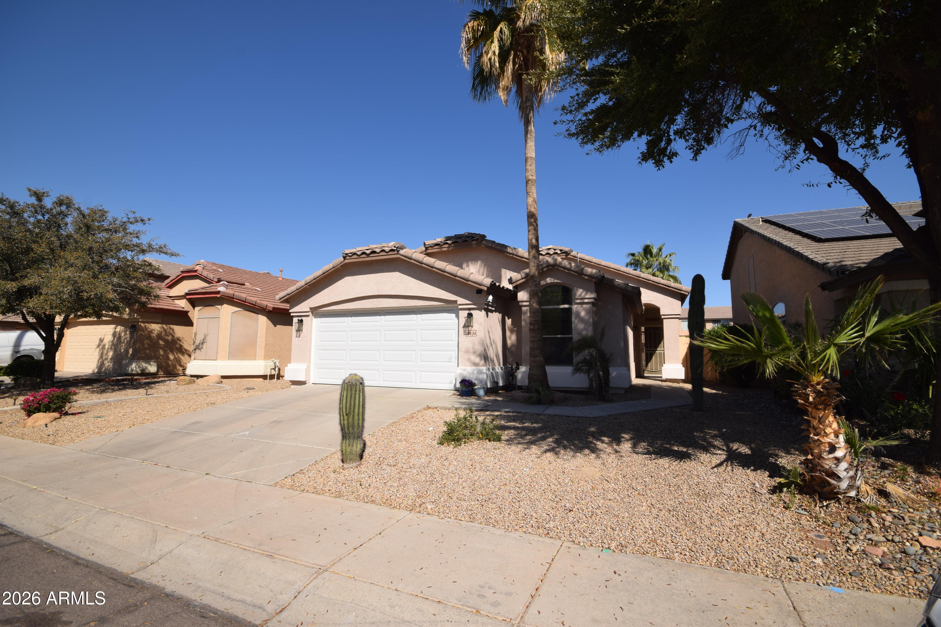 If you're looking for a well-maintained home with a split floor plan & a pool that has a waterfall feature, then look no further than this home.  Walking into this home you will appreciate the laminate flooring in the living room & 2 bedrooms & tile flooring in the bathrooms & kitchen for easy care. The kitchen has jet black cabinetry, stainless steel appliances & plenty of counter space. The owner's suite is located away from the other 2 bedrooms & has French doors, carpet & is very spacious. The owner suite bathroom has a lot of natural light, soaking tub, separate shower, dual sinks & walk-in closet. Your backyard oasis has a side patio to keep you cool, natural grass area, along with a play pool with waterfall feature. **WILL PAY OFF SOLAR AT CLOSING** Don't miss this home.