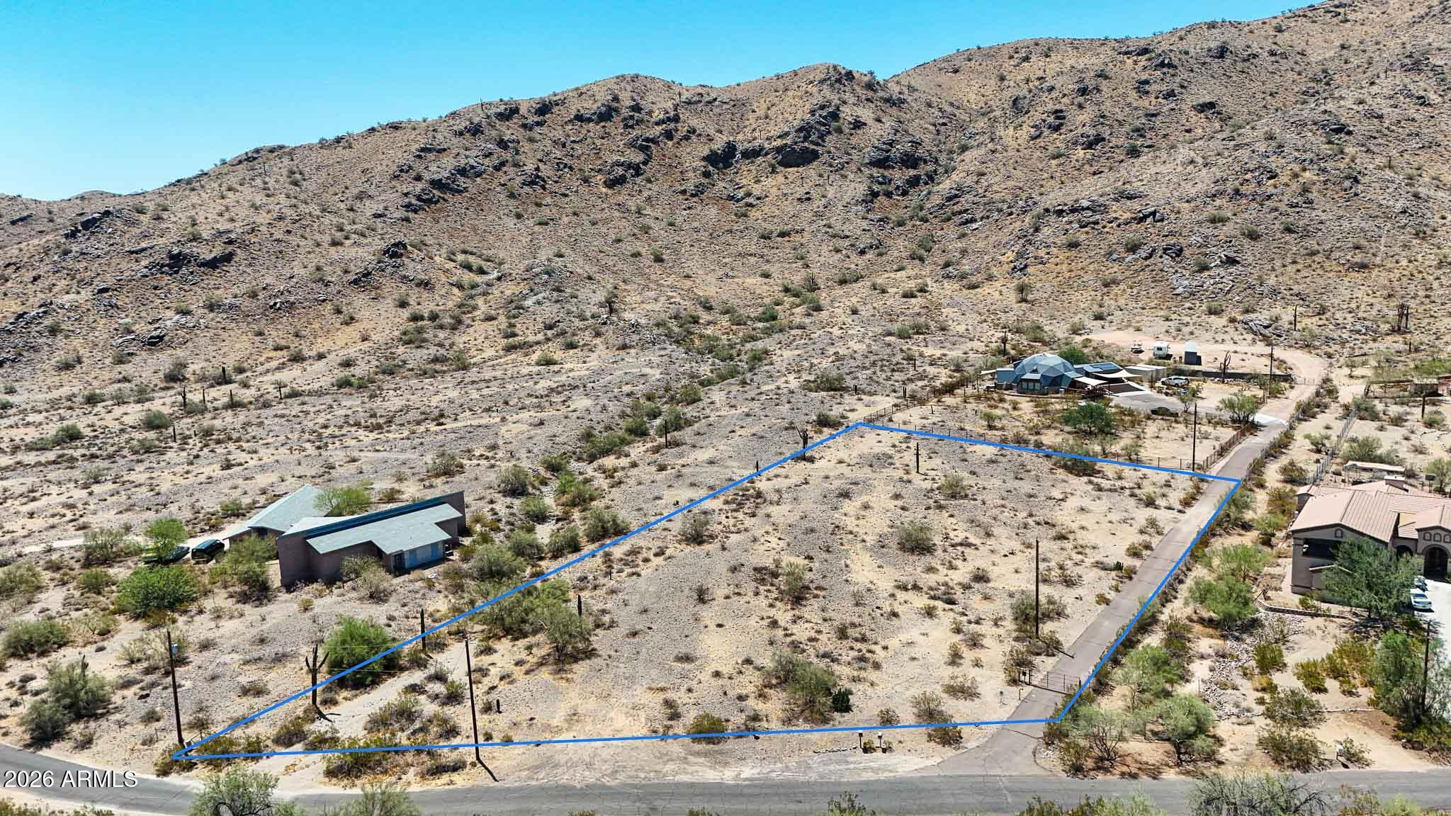 Rare opportunity to build your dream home on an exceptional 1.63 acre homesite offering breathtaking panoramic views in every direction. Enjoy spectacular city lights, stunning South Mountain vistas, and unforgettable Arizona sunsets from this private desert retreat with no HOA restrictions. Nestled in a peaceful, secluded setting, this premium parcel provides a generous, highly usable building envelope ideal for a custom estate, guest house, RV garage, or resort-style outdoor living. Surrounded by natural desert beauty, you'll enjoy direct access to miles of hiking, biking, and horseback riding trails, with South Mountain Preserve and the Highline Canal just moments from your doorstep. Despite its tranquil atmosphere, the property is conveniently located just minutes from Downtown. Phoenix, Sky Harbor International Airport, Arizona State University, major freeways, Ahwatukee, shopping, dining, and entertainment. Experience the perfect balance of privacy, convenience, and endless possibilities. An exceptional opportunity to create a one-of-a-kind luxury residence in one of Phoenix's most desirable hillside locations. The adjacent residence is also available for purchase, presenting a rare chance to own an expansive multi-acre estate.
