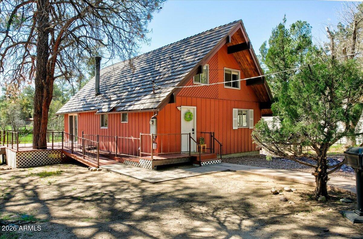 Escape the ordinary & the desert heat for your private getaway in Historic Prescott just a couple minutes from the iconic Courthouse Plaza. Tucked away on a quiet cul-de-sac, this A-Frame hideaway is so rare- the kind of serene setting that's hard to find and even harder to leave. Step inside the great room and take in the warm natural light of the picture windows that frame the gorgeous surroundings, the seasonal creek & an abundance of wildlife. The bunkhouse loft sleeps seven & it's the perfect place to create childhood memories. Thoughtfully updated throughout, the home offers ADA-accessible living with a walk-in shower, ensuring comfort and ease for every stage of life. Nearly a quarter-acre gives you room to breath & play; bring the dogs, the kids, fire up the grill and gather with friends & family on the deck, the backyard and on the Basketball sport court. Whether you're searching for a full time residence, a cool-weather escape from the Valley, or a weekend retreat with genuine character, this property delivers & is the perfect place to slow life's hurried pace. Downtown restaurants, galleries and festivities are within easy reach. This is Prescott, exactly as it should be.