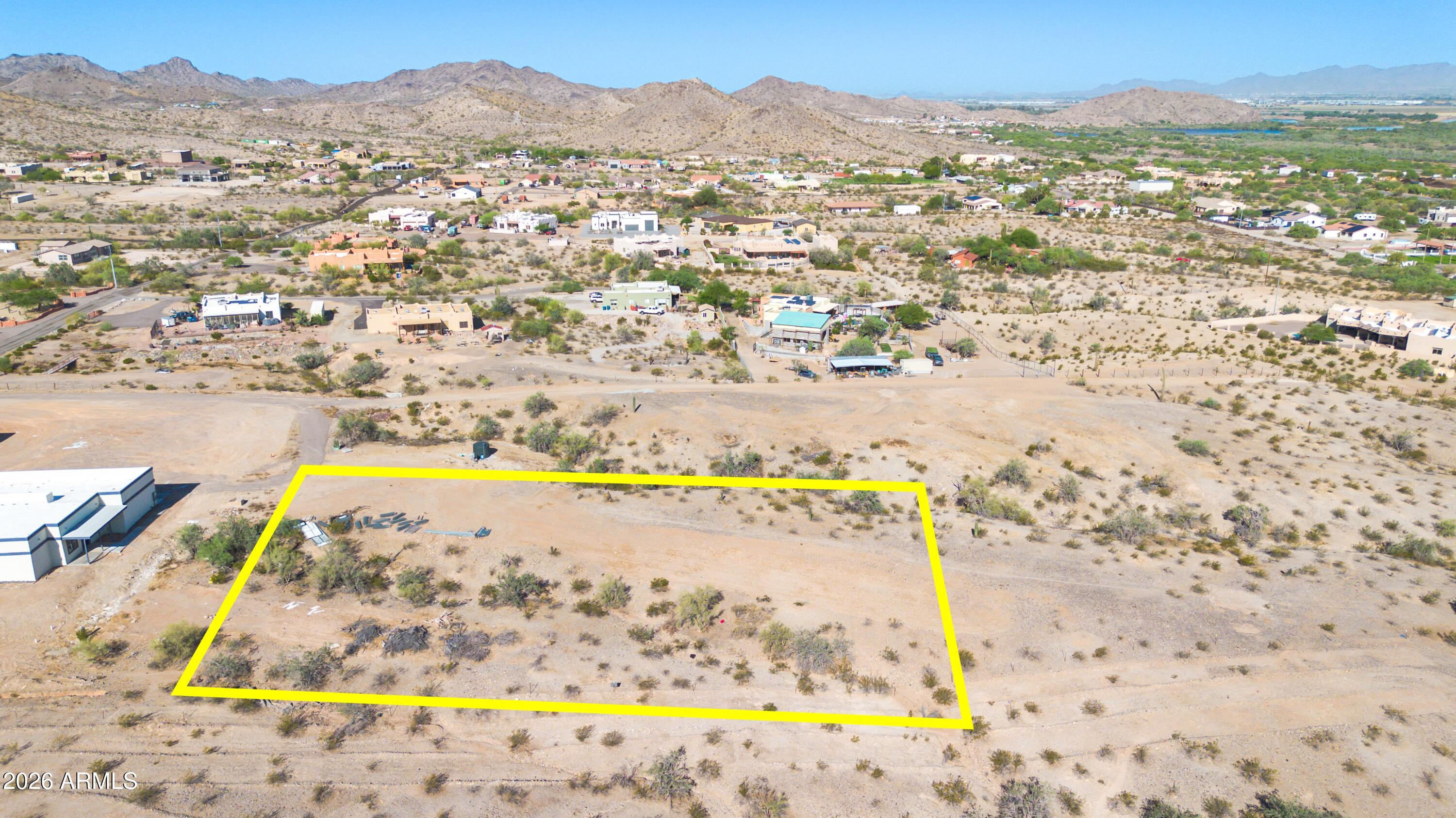 Prime 1-acre parcel offering outstanding views and exceptional privacy. The unobstructed views, create the perfect setting for a custom home with desert scenery and gorgeous views of the Estrella mountains. A recorded, shared well deed is included. Electricity is adjacent to this parcel, and there is no HOA. This is a rare opportunity to secure a premium building parcel with remarkable views, privacy, and essential utilities close by. Walk the property and experience its beauty and the incredible views of the Estrella mountains in person. The property has rights to a shared water well with pump installed and storage tank. There are many possibilities with this land, while still enjoying these incredible views.