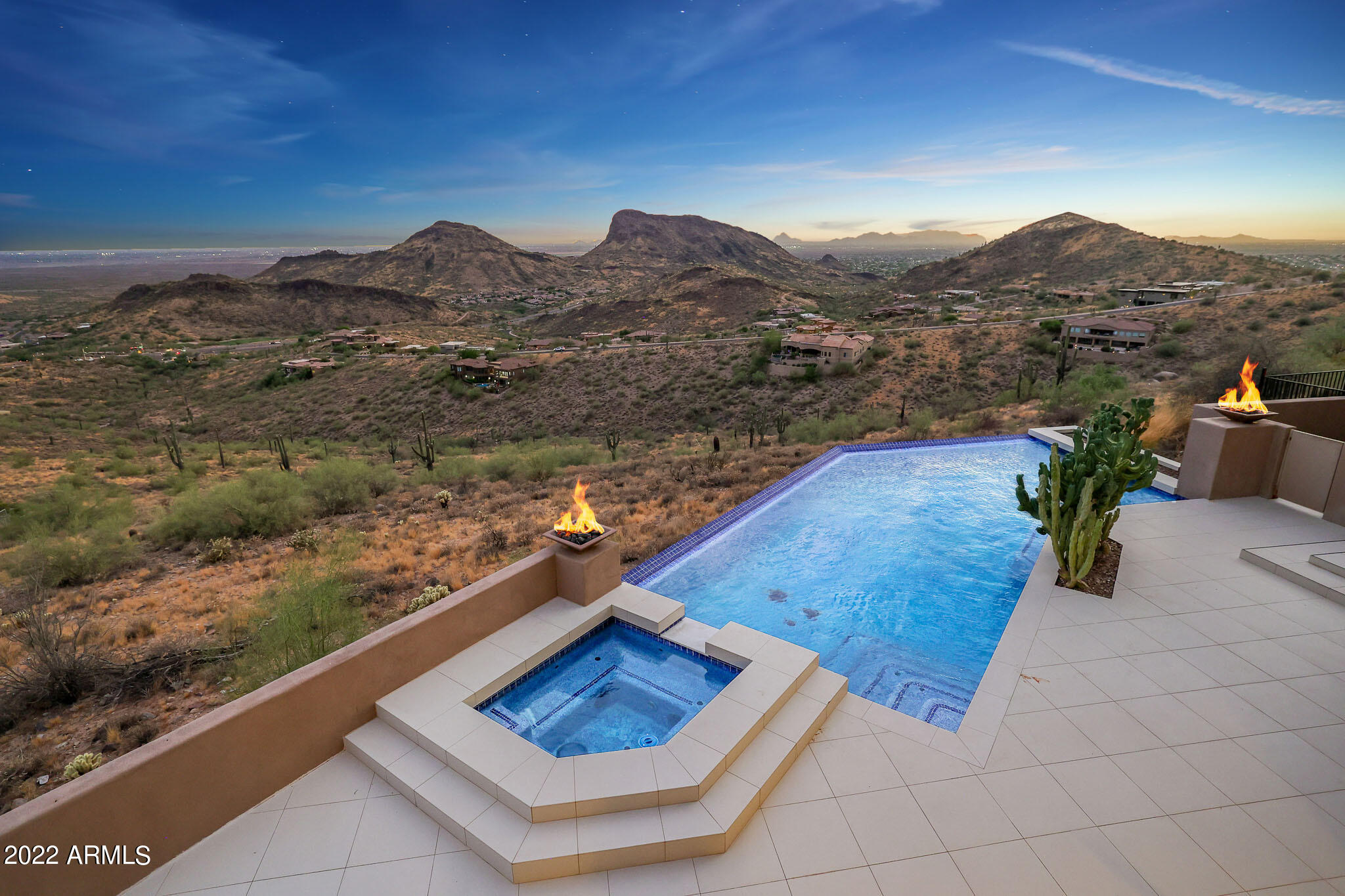 Experience jaw dropping panoramic views from the highest hillside home in Fountain Hills! This is an entertainer's dream home, like nothing you've seen before! Modern open style floorplan with floor to ceiling windows framing the stunning views of the valley! Designed for true indoor/ outdoor style living with ample covered patio space. Home is appointed with automatic blinds. Kitchen is open to formal dining space and living room with sleek statement fireplace. Master on main level split from guest quarters. 6 car garage with room for lifts! Backyard oasis overlooking the forever unobstructed views with extended covered patios, negative edge pool,spa, fire pit, and outdoor kitchen with built in BBQ.This cul-de-sac home is an absolute show stopper,once you see it you'll never want to leave