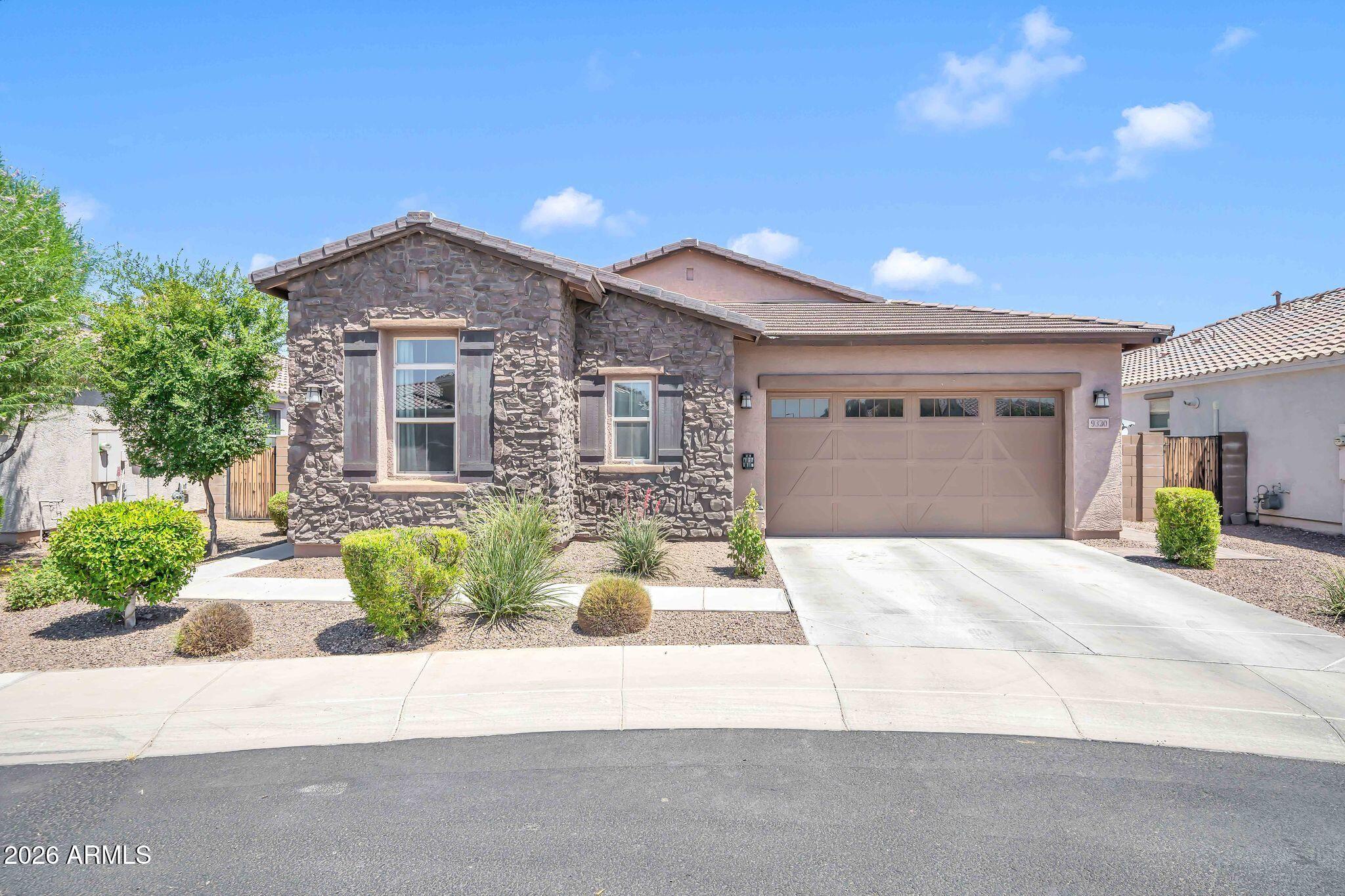 **New Carpet Just Installed & Seller Offering a $10,000 Buyer Incentive** toward Closing Costs or an Interest Rate Buydown! This Gorgeous 2018 Single-Level Home is nestled in a desirable Gated Community just minutes from Loop 101 & Camelback, placing you only 5 minutes from State Farm Stadium, Desert Diamond Arena, Tanger Outlets, Westgate Entertainment District, premier dining, shopping, and year-round events. Inside, you'll love the bright Open-Concept Great Room with a desirable Split Floorplan featuring a private Primary Suite and two spacious secondary bedrooms connected by a versatile Bonus/Teen Retreat. The Gourmet Kitchen showcases a large center island with breakfast bar, deep basin sink, stainless steel appliances, beautiful 42-inch white cabinetry, and abundant storage. The inviting Great Room is filled with natural light from expansive windows and a dramatic sliding glass door that seamlessly blends indoor and outdoor living. Step outside to your private backyard retreat featuring a spacious covered patio, lush low-maintenance artificial turf, and an oversized 7,044 SF homesite with plenty of room to relax, entertain, or create your dream outdoor oasis. Additional upgrades include soaring 9-foot ceilings, a tankless water heater, whole-house soft water system, and professionally completed landscaping, allowing you to simply move in and enjoy. The beautifully maintained community offers scenic walking paths, expansive grassy parks, ramadas, and playgrounds, creating the perfect setting for an active lifestyle. Whether you're hosting family and friends or enjoying a quiet evening at home, this exceptional property offers comfort, style, and convenience with easy access to Downtown Phoenix, Sky Harbor International Airport, and all the exciting dining, shopping, sports, and entertainment the West Valley has to offer.
