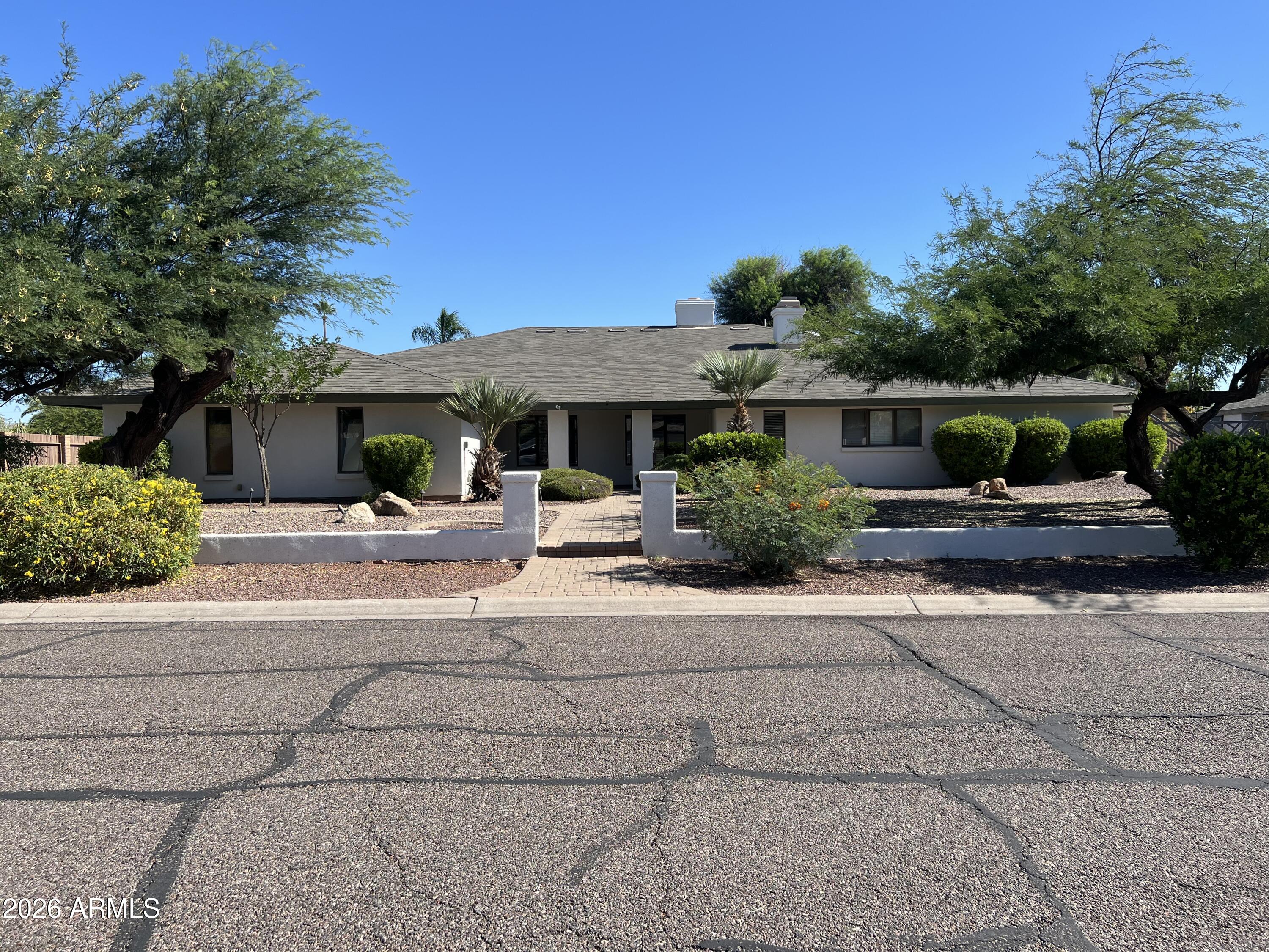 Tucked away along the highly desirable Shea Corridor, this rare property offers the perfect blend of peaceful desert living and exceptional city convenience.
This fully updated home is situated on a 21k sf lot and presents a unique opportunity for multigenerational households or guest accommodations. The property features a 5bed/3bath, 3,649sf main residence complemented by a 2bed/1bath detached 855sf guest house  (with the living room currently configured as a third bedroom). Together, the residences provide an impressive 4,504 square feet of livable space. Vaulted ceilings, luxury vinyl plank flooring, white shaker cabinetry and granite countertops throughout the main and guest home. Lush and serene backyard, dual paned windows and generous parking. Ideally located near the Phoenix Mountain Preserves and just minutes from SR-51, Sky Harbor International Airport, shopping, dining, and everyday conveniences.
A truly rare offering combining size, versatility, and location in one of North Phoenix's most sought-after corridors.