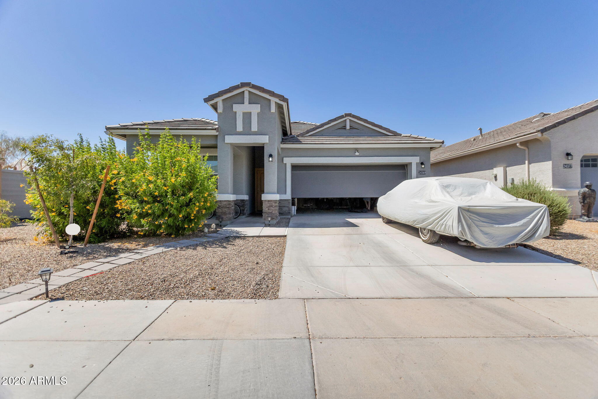 Welcome to this beautifully maintained 4-bedroom, 2-bath home in the desirable Estrella Vista community. The inviting curb appeal features a covered front porch, low-maintenance landscaping, and a 2-car garage. Inside, the bright and open floor plan is filled with natural light and showcases neutral finishes, tile flooring throughout the main living areas, and comfortable carpeting in the bedrooms. The well-appointed kitchen features granite countertops, stainless steel appliances, a pantry, recessed lighting, crown-molded cabinetry, and a large island with breakfast bar seating--perfect for everyday living and entertaining.