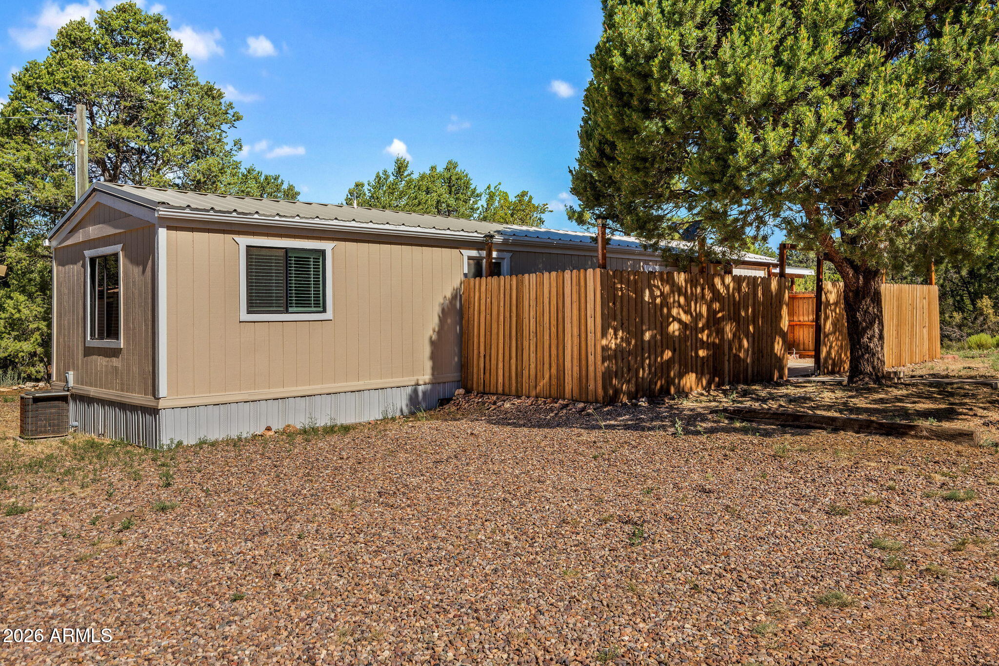 Escape to the cool mountain air in this move-in ready 2-bedroom home featuring a desirable split floor plan. Stay comfortable year-round with electric forced-air heat and a mini-split heating and cooling system. Relax on the covered entry or side deck, while privacy fencing creates your own peaceful retreat. Additional highlights include a durable metal roof, carport, RV parking, and no HOA. Conveniently located in the heart of Heber-Overgaard with easy access to shopping, dining, and local services. Perfect as a full-time residence, weekend getaway, or seasonal escape!