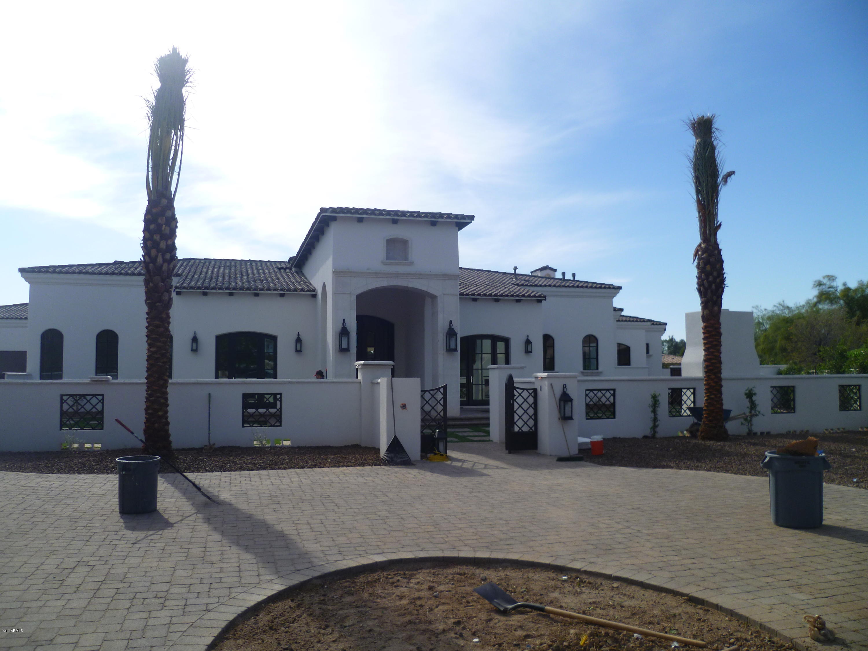 Brand new ''transitional'' style magnificent custom home being built right now by the amazing Regal American Homes!!  This beauty has smashing Mummy Mtn views from your home & the back patio & pool entertaining areas!  Love this quiet cul-de-sac lot w/ sunny south backyard sun exposure & huge covered patios for the best AZ outdoor lifestyle! Your buyers will eat this new custom home up w/ it's spectacular open floor plan, stunning over the top finishes &  quality craftsmanship!  Wood floors for a warm inviting feel---but very clean lines w/ soft grey & white tones & a huge gourmet chef's kitchen in custom white cabinetry w/ white marble  slab counter tops + top of the line Sub-Zero/Wolf/Asko appliance pkg---for your new dream kitchen to entertain your family & friends in style! Palatial master suite w/ a decadent master bathroom + large sep. HIS-HER walk-in closets!