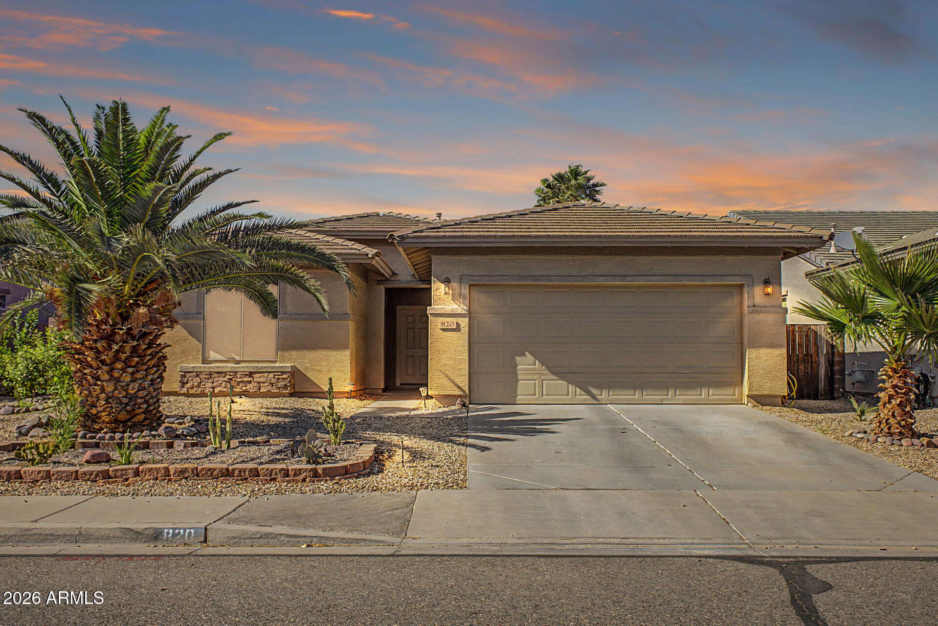 FHA ASSUMABLE 2.75% $1936 total monthly mortgage • SOLAR • OASIS BACKYARD Pride of ownership shines in this Johnson Ranch home.  Features include a desirable great room floor plan with open living and dining. The kitchen offers coffee stained maple cabinetry, granite counters with undermount sink, drinking water filtration system and 4 burner gas stove. Need a fridge? Add it to your offer! Updates include newer carpet, water heater, and soft water system. Primary bath with separate garden tub and shower. Enjoy a private oasis backyard with a spacious covered patio, real grass, fruit trees, river rock wash with walking bridge and cactus garden in front too.  Gas or electric dryer. Solar helps keep energy costs low.  Incredible opportunity with an FHA assumable loan at just 2.75%!