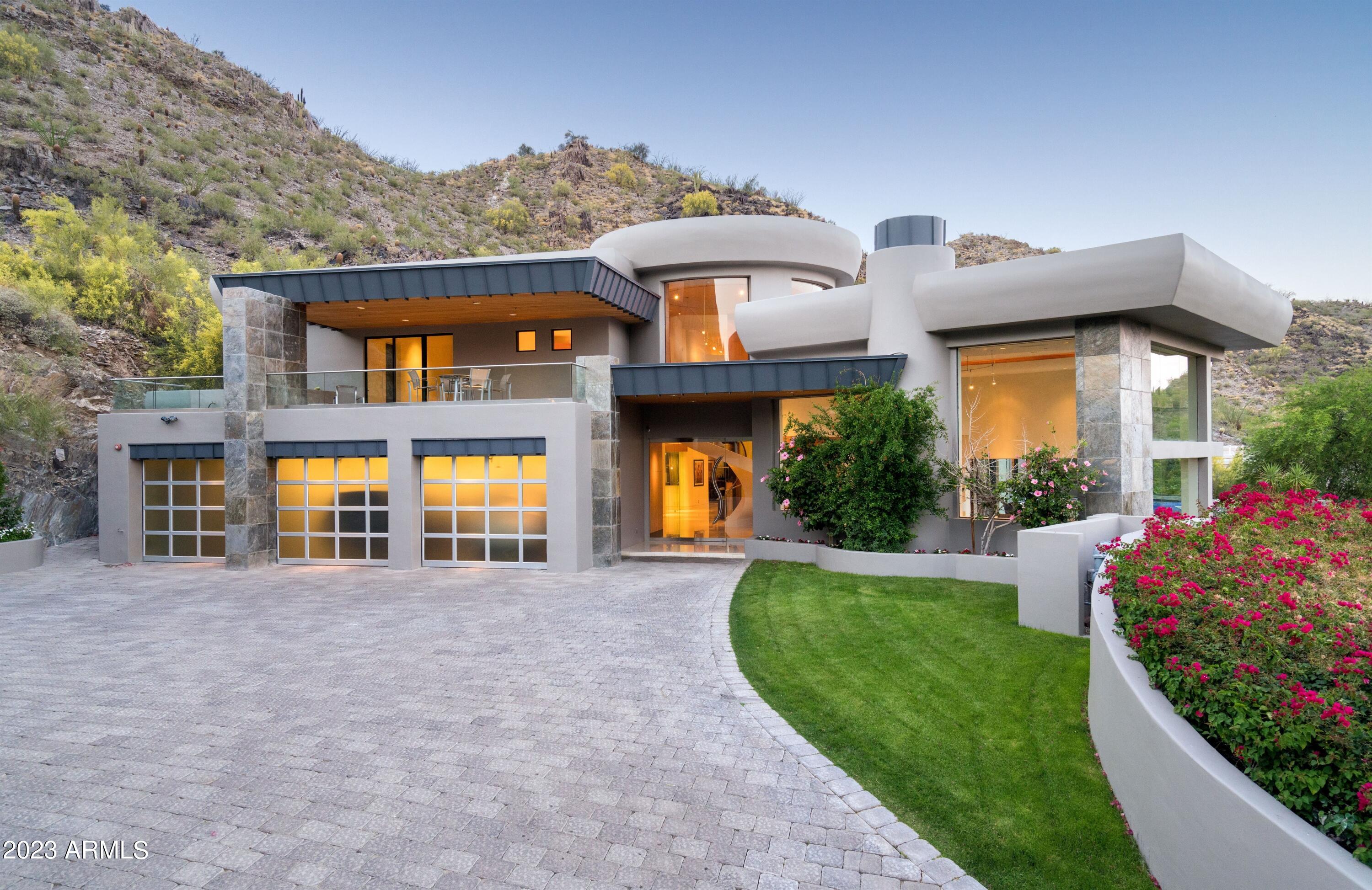 INVESTMENT OPPORTUNITY! Fantastic opportunity to own an amazing piece of Paradise Valley with BREATHTAKING panoramic views that stretch from Mummy Mountain and Paradise Valley all the way out to the East Valley. This exquisite property has a flawless floor plan, offering all the luxurious details you could want with 24-foot ceilings, 6 fireplaces, Biometric secured closet and a movie theatre with bar/lounge. Nestled in the Phoenix Mountain Preserve, you'll have convenient access to all the amenities and attractions Arizona has to offer while still offering privacy in a tranquil setting. This incredible opportunity presents a canvas for your creativity and vision. Experience the ultimate blend of luxury, location, and privacy with the potential to make this slice of paradise your own!
