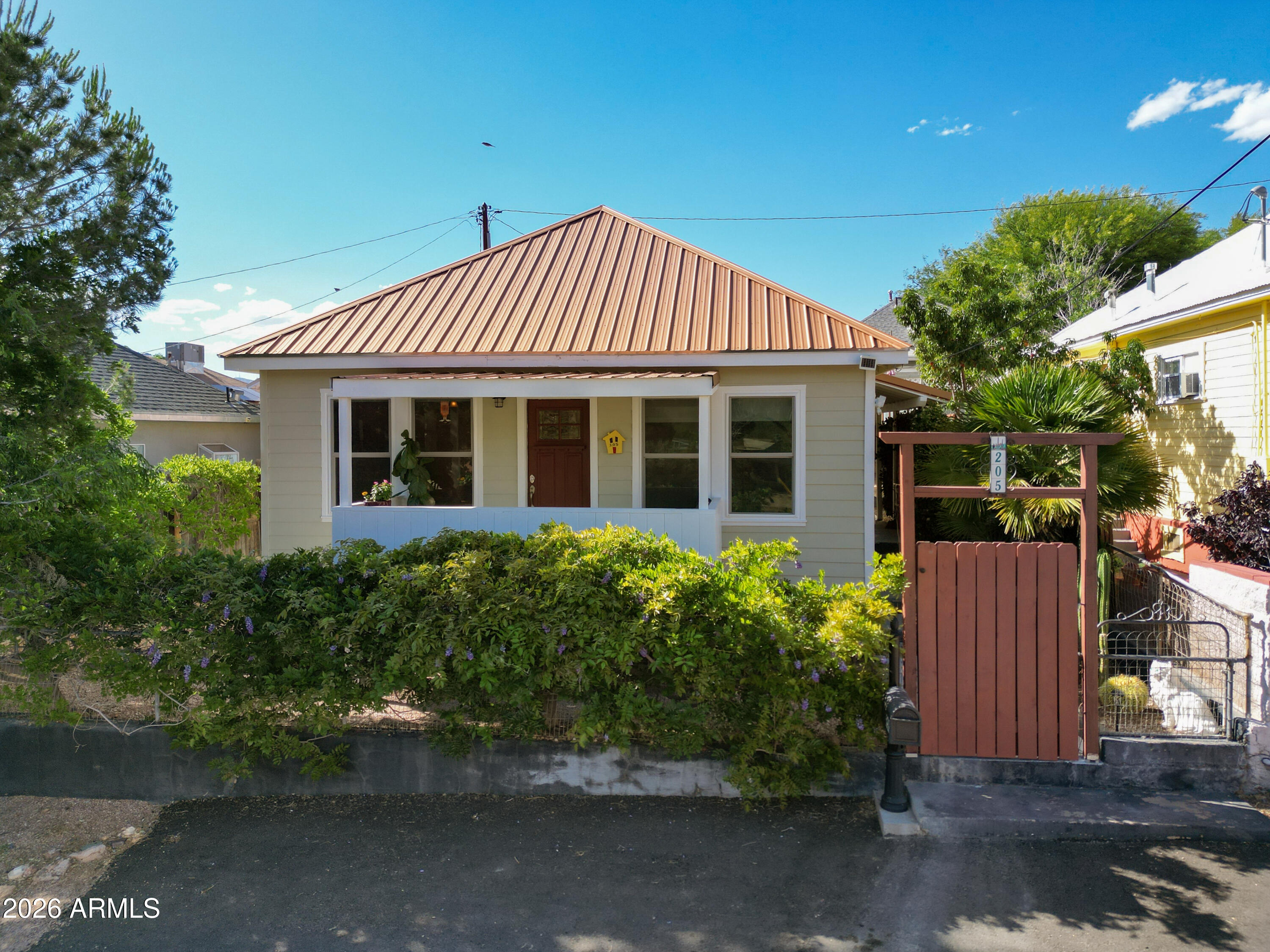 Charming fully remodeled home in Bisbee's Warren neighborhood! MUCH more than a one bedroom, the value here goes far beyond bedroom count: extensive remodeling, expanded living space, RV parking, historic Bisbee charm, and a beautifully usable outdoor setting create a property that lives much larger than expected. This thoughtfully updated home blends historic character with modern convenience and includes a spacious rear addition with bonus mudroom, bedroom and bath. The beautifully renovated kitchen features custom handmade knotty alder soft-close cabinetry with pullouts, granite countertops, farmhouse sink, and all new appliances. Enjoy being one of the only homes in the neighborhood with a pot filler and wine cooler! Cont'd... Mudroom area could be used as extra guest space with a daybed or futon. Home upgrades include new roof, new plumbing and electrical, HardyBoard siding, whole-house Pentair Pelican carbon water filtration system, new water heater, zero-grade entry shower, and utility sink. RARE RV parking with electric/water hookups and RV dump offers exceptional flexibility for the area, plus additional front parking. Enjoy the balcony, three storage sheds and inviting cottage-style charm just minutes from the historic center of town!