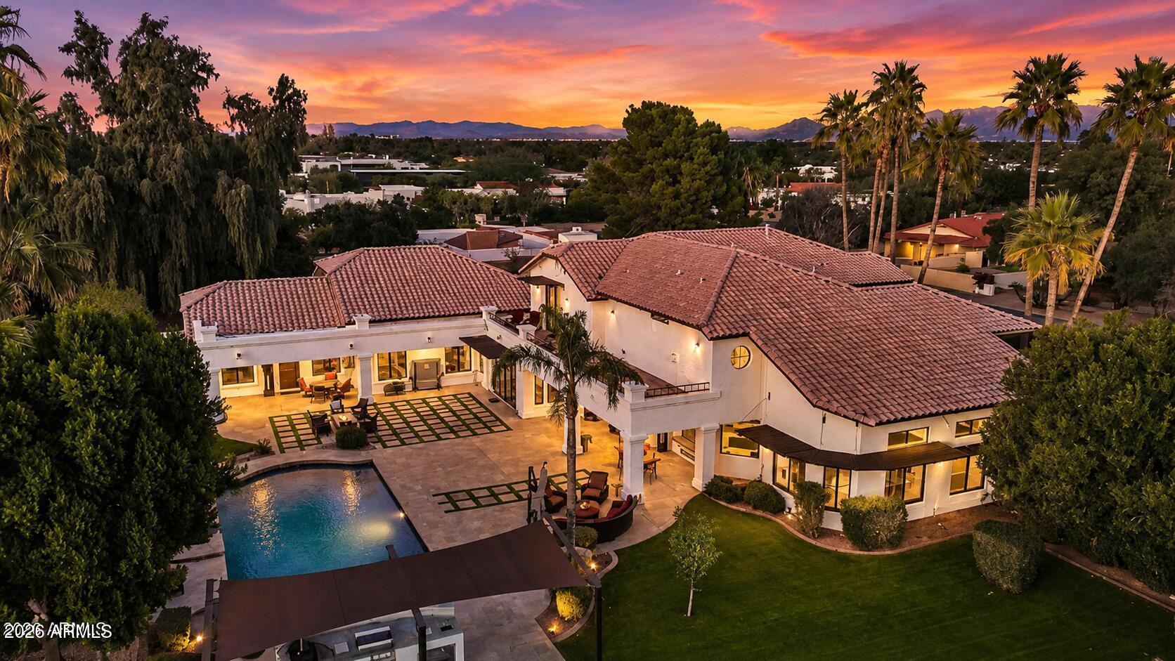 ~PRIME LOCATION, MOUNTAIN VIEWS, GUEST HOUSE, & $1.5M IN RENOVATIONS!~ 
A rare, large-scale Paradise Valley estate featuring architectural volume, an on-property guest house, and infrastructure-level upgrades, offered below $525 per square foot in one of the area's most central and desirable locations. Dramatic 20-foot ceilings anchor the primary living spaces, delivering volume and natural light that distinguish the home within the Paradise Valley market. The property has been meticulously enhanced with over $1,500,000 in upgrades, including fully remodeled kitchens with Sub-Zero and Wolf appliances, extensive secondary bathroom renovations, premium custom cabinetry, and updated flooring featuring travertine, new carpet, and refinished hardwoods, creating continuity and flow throughout the interior.
A full basement, an uncommon feature in Paradise Valley, provides substantial flexibility for recreation, fitness, storage, or future customization. An on-property guest house adds meaningful space for extended stays, private accommodations, or workspace. Garage capacity is equally notable, offering a 5-car garage, including a newly added, air-conditioned 2-car garage with high ceilings, suitable for vehicle storage, specialty use, or hobby space.
Outdoor living has been comprehensively reworked for year-round use, highlighted by PebbleTec pool resurfacing, new pool equipment, a custom outdoor kitchen, awnings, and a complete landscaping overhaul with updated irrigation, lighting, and hardscape elements.
Additional improvements include two NEW HVAC systems, full exterior stucco and paint, window replacements and tinting, recessed lighting upgrades, and basement system enhancements.
Positioned within highly regarded Paradise Valley school zones and located minutes from Scottsdale, the Biltmore corridor, luxury resorts, championship golf, dining, and shopping, this estate presents a compelling combination of location, scale, functionality, and long-term value in one of Arizona's most established luxury markets.
