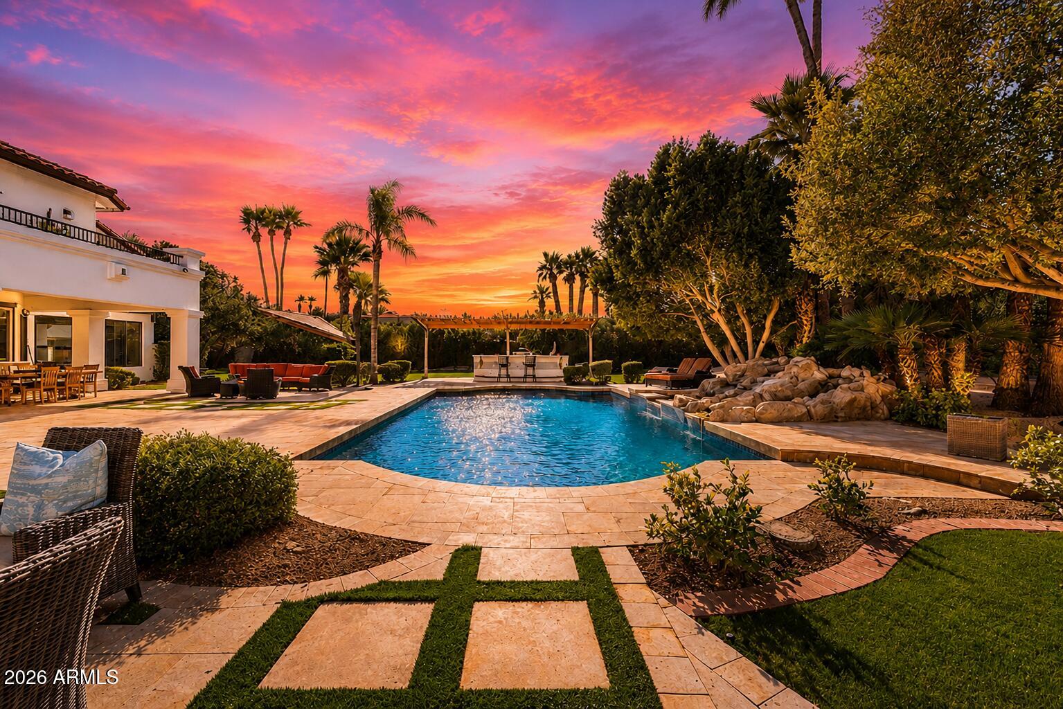 ~PRIME LOCATION, MOUNTAIN VIEWS, GUEST HOUSE, & $1.5M IN RENOVATIONS!~ 
A rare, large-scale Paradise Valley estate featuring architectural volume, an on-property guest house, and infrastructure-level upgrades, offered below $525 per square foot in one of the area's most central and desirable locations. Dramatic 20-foot ceilings anchor the primary living spaces, delivering volume and natural light that distinguish the home within the Paradise Valley market. The property has been meticulously enhanced with over $1,500,000 in upgrades, including fully remodeled kitchens with Sub-Zero and Wolf appliances, extensive secondary bathroom renovations, premium custom cabinetry, and updated flooring featuring travertine, new carpet, and refinished hardwoods, creating continuity and flow throughout the interior.
A full basement, an uncommon feature in Paradise Valley, provides substantial flexibility for recreation, fitness, storage, or future customization. An on-property guest house adds meaningful space for extended stays, private accommodations, or workspace. Garage capacity is equally notable, offering a 5-car garage, including a newly added, air-conditioned 2-car garage with high ceilings, suitable for vehicle storage, specialty use, or hobby space.
Outdoor living has been comprehensively reworked for year-round use, highlighted by PebbleTec pool resurfacing, new pool equipment, a custom outdoor kitchen, awnings, and a complete landscaping overhaul with updated irrigation, lighting, and hardscape elements.
Additional improvements include two NEW HVAC systems, full exterior stucco and paint, window replacements and tinting, recessed lighting upgrades, and basement system enhancements.
Positioned within highly regarded Paradise Valley school zones and located minutes from Scottsdale, the Biltmore corridor, luxury resorts, championship golf, dining, and shopping, this estate presents a compelling combination of location, scale, functionality, and long-term value in one of Arizona's most established luxury markets.