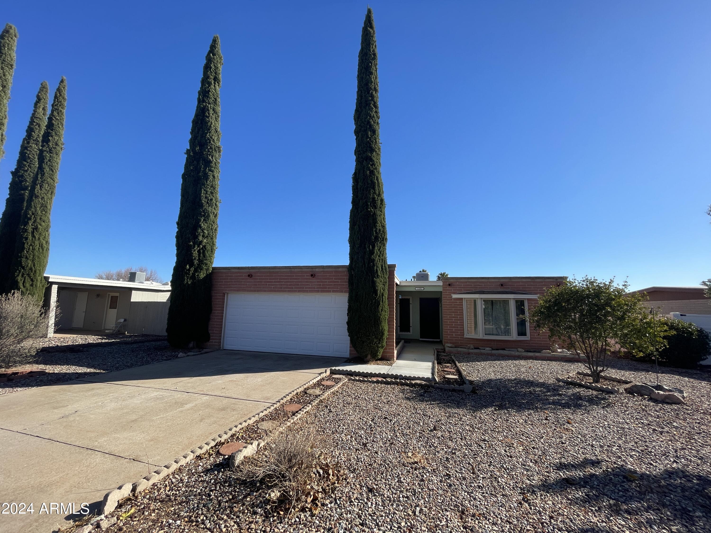 CUTE HOME, Move In Ready!! 
Conveniently located near all the Sierra Vista amenities and just minutes to Fort Huachuca. This home boasts 3 larger bedrooms 2 updated baths, 2 car garage, newer triple pane windows. The upgraded Kitchen has granted countertops, VERY NICE like new custom cabinets, soft close and pull out drawers, dishwasher, garbage disposal, and gas range. Plenty of space with a Living room and family room. Backyard has a storage shed, covered patio, and grass and trees. Must see this home, won't last long.