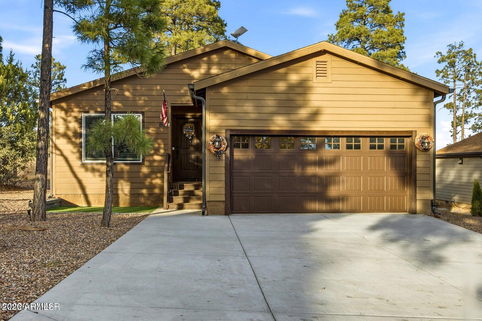 Located in the beautiful gated community of The Village in Show Low, this fully furnished single level 3 bedroom, 2 bath home offers comfort, charm, and convenience. Designed for easy living, it features a 2 car garage, nicely landscaped yard, and a functional layout all on one level. Enjoy year round comfort with forced air gas heating, central AC, and a gas water heater, along with smart home technology for modern, connected living. Step outside to a stunning covered back deck with peaceful views of the tall pine trees, plus a beautifully pavered area that creates the ideal hangout spot for relaxing evenings, entertaining friends, or gathering under the mountain sky. This home blends mountain charm with everyday comfort in a highly desirable gated setting.