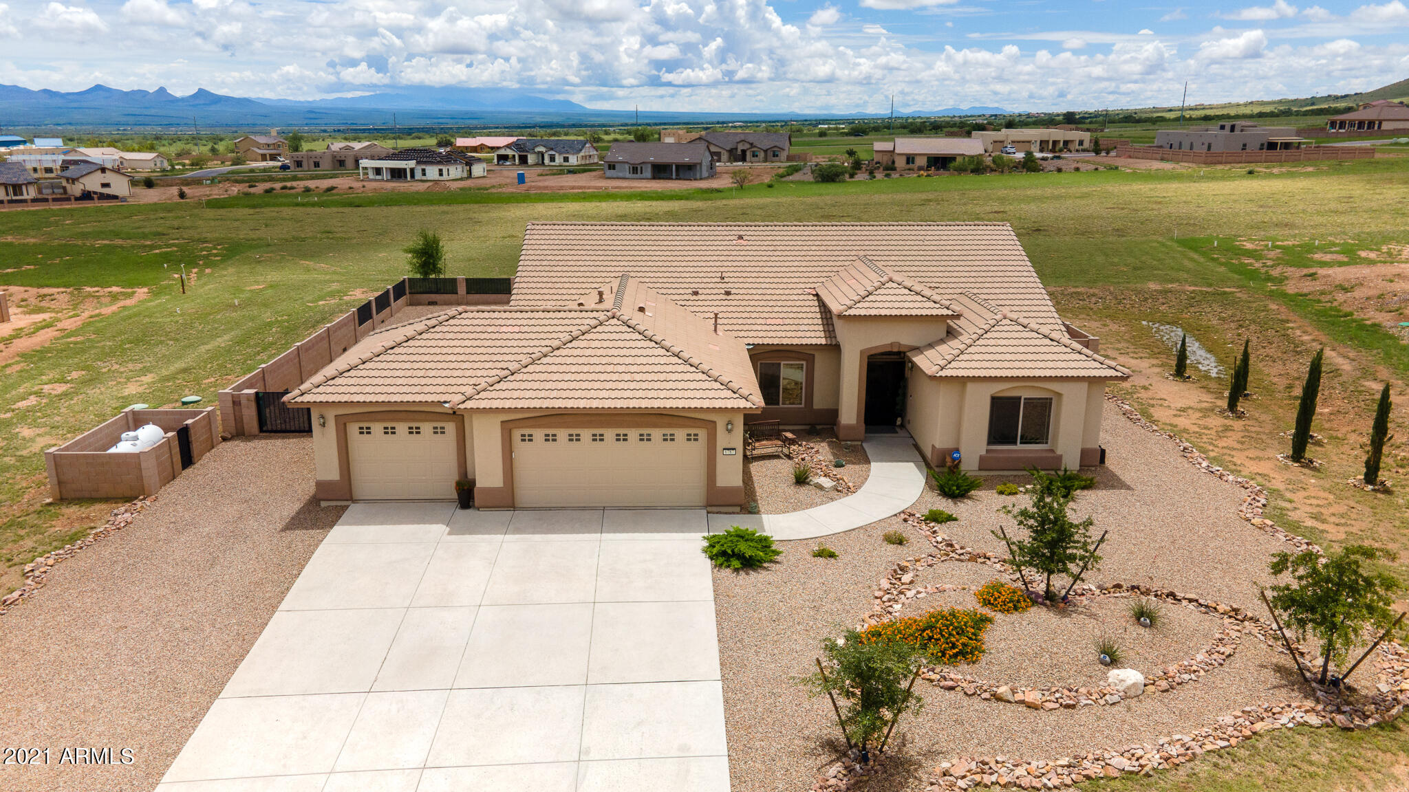 Come enjoy the AMAZING panoramic views in this beautifully built RL Workman Home in Kings Ranch.  The home sits on just over an acre of land with block wall enclosing and critter proofing the fully rocked backyard. Interior features include 2443 sqft, 4 bedroom/2 bath, two living areas, large modified open kitchen with granite counters, hi-low cabinets, double oven, gas cook-top, stainless steal microwave, dishwasher and refrigerator and custom tile.  The master suite includes double vanity, private toilet area, oversized garden tub and walk in shower. Other upgrades are the 3 car garage, expanded covered patio with salt finish exterior concrete, security doors, landscaped front yard and privately owned propane tank.  This home is Energy Star & Environments for Living Certified. Call Now!