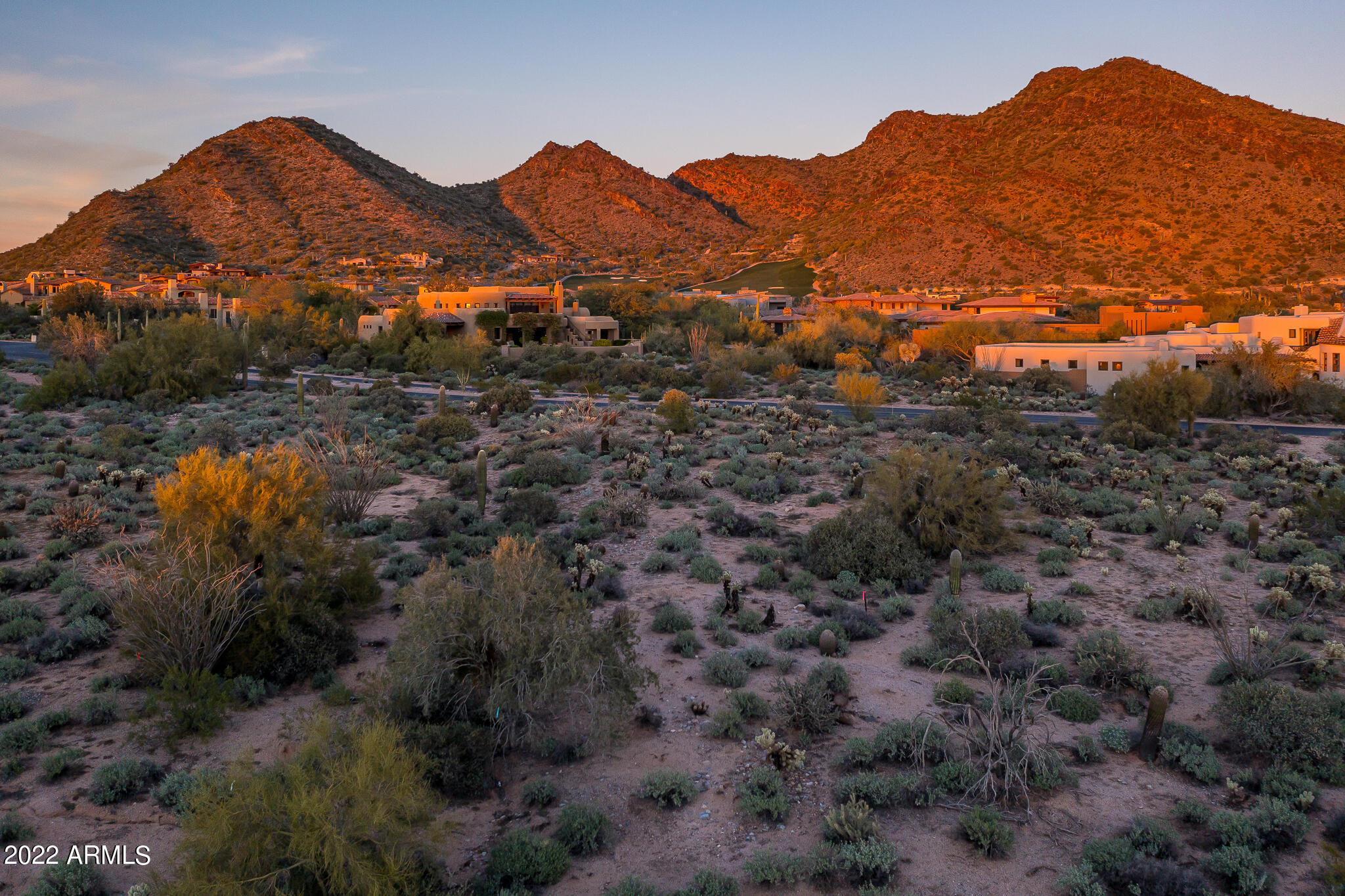 Rare DC Ranch custom homesite...one of the very last build opportunities in this prestigious community.  This oversized 1.19-acre site has the unique combination of sweeping mountain views and gentle grade conditions for an easy build.  Generous building envelope of 26,919 sf. Price includes architectural plans by renowned architect Bing Hu. Plans are currently in design review for a 8041-sf house. Buyer can select the builder of their choice.  Located just a few blocks from the club and connected via community sidewalk.  DC Ranch is highly regarded for its private golf, guard-gated security, miles of paths and trails, and access to nearby Market Street retail and restaurants. Proposed floor plans located  under documents.