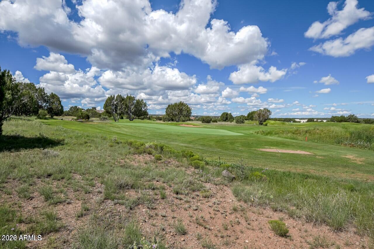 Nestled in the desirable, gated Eaglescrest community, this rare nearly half-acre parcel (approx. 0.46 acres) offers an exceptional opportunity to build your custom home directly on the golf course. Located at 8414 Lake View Dr, Show Low, AZ 85901, the property sits across the street from the serene, private shores of White Mountain Lake, providing convenient access to world-class fishing, boating, water skiing, jet skiing, kayaking, and more--no horsepower restrictions!
Enjoy the best of both worlds: stunning golf course views and fairway proximity right out your future doorstep, with easy access to the highly rated Birdie Ranch Golf Course at Silver Creek just moments away. Other championship courses like Bison Golf Club, Torreon, and more are a short drive for year-round play in the beautiful White Mountains.
Utilities are ready and waiting (electric, water, and sewer), and lake rights are included, so you can start planning your ideal mountain retreat immediately. The gated community ensures privacy and security, while the location--just minutes from Show Low and Snowflake--delivers convenient access to shopping, dining, amenities, and all the White Mountains lifestyle has to offer.
This prime parcel is a true rarity in the area--don't miss your chance to secure your piece of paradise in Eaglescrest, with golf course living and lake access at your fingertips!