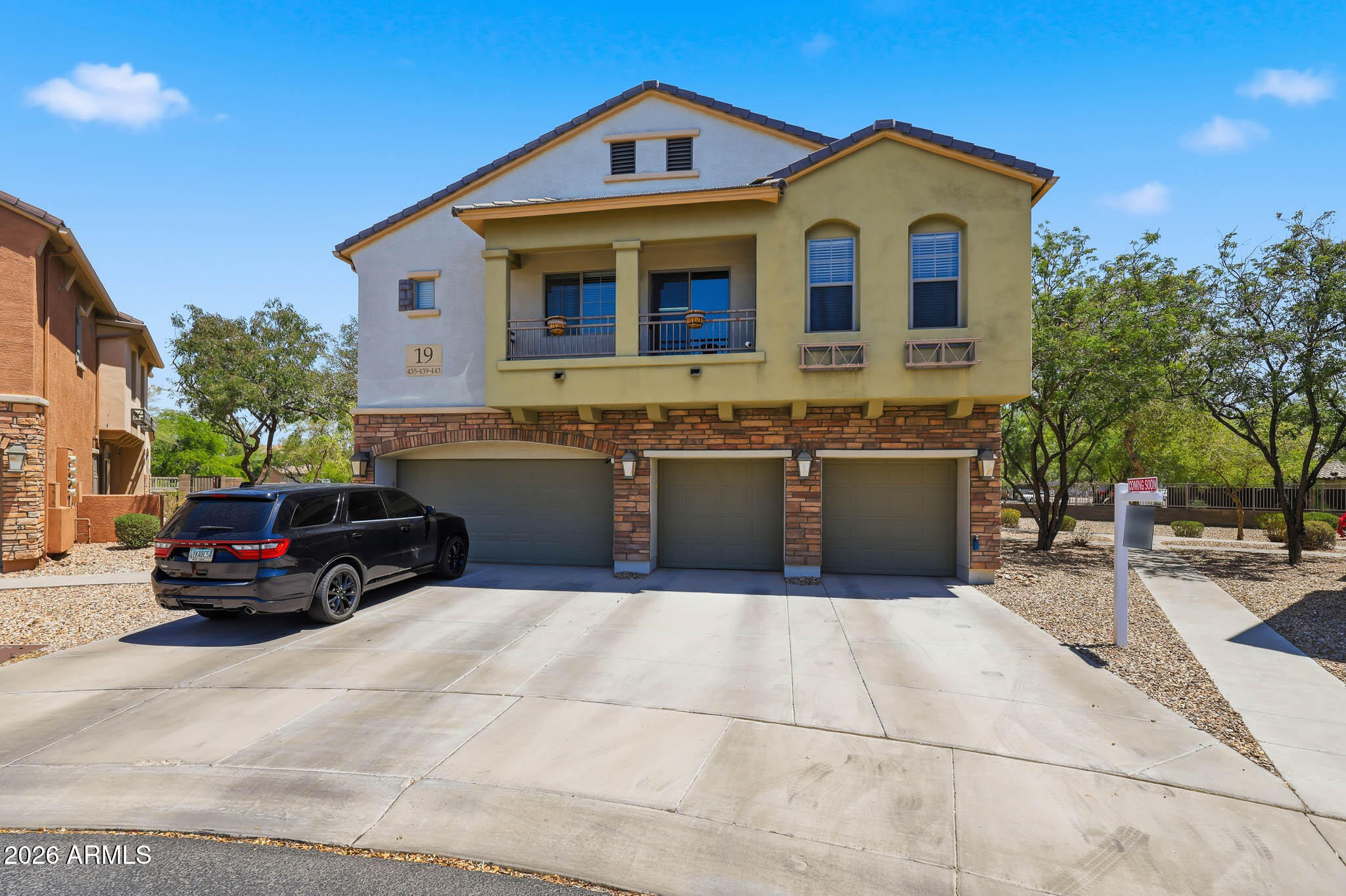 Welcome to this well-maintained 2-bedroom, 2-bath townhome in the desirable Canyon Trails Courthomes community in Goodyear! Single-story living with 1,130 sq ft, carpet and vinyl flooring, a private toilet room, and a balcony. The kitchen features an electric cooktop, dishwasher, built-in microwave, disposal, and a walk-in pantry. Enjoy the community pool and biking/walking path just steps away. Convenient access to the 303 & I-10, shopping, dining, and Desert Thunder/Desert Edge schools. Two HOAs cover exterior maintenance, roof repair & replacement, blanket insurance, water, sewer, and garbage. Rentals OK! Don't miss this move-in ready opportunity in a fantastic Goodyear location!