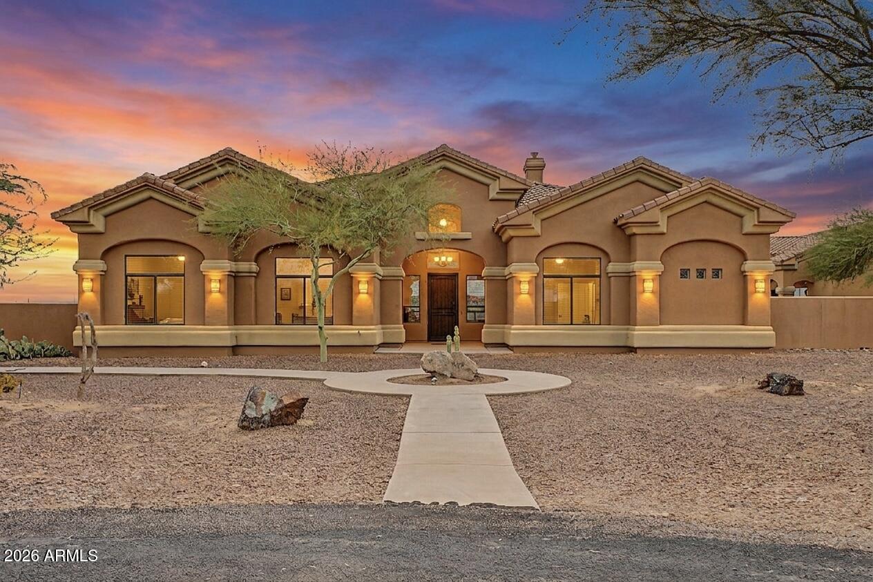 Welcome to Southwest Luxury! This stunning pool home will Wow you from the moment you arrive. Sitting on a 1.3-acre lot with no HOA, drive down your huge driveway which leads to a 3-car garage with epoxy floors & attached cabinets, plus RV gate and parking perfect for toys, trailers, and more. The interior showcases the properties elegance with Brand New Carpet and padding,  Brand new interior paint, soaring coffered ceilings with contemporary lighting, abundant natural light pouring in, and a fireplace to add warmth to the heart of the home. The kitchen is a chef's dream, offering custom cabinetry, multiple ovens, granite countertops, stack stone accents and a brand new faucet and disposal. Did we mention the pool house?  1,300 sq ft poolside casita is perfect for entertaining. The casita features a large saloon style bar, TV's, pool table, and even has its own half bath. This is where the party happens! The backyard has a large swimming pool, extended length covered patio, additional shade structure, basketball court, dedicated fire pit area, plenty of room for parking, and the shed is also included. The property also has a back up generator in case the power ever goes out. This isn't just a house, this is an estate. The home is move in ready with New Carpets and Paint, tile floors steam cleaned, multiple plumbing fixtures are brand new, light bulbs replaced, all HVAC's inspected and tuned up, and many items convey with the home. This will be a special place to call home for the next lucky owner. Hurry up and see this one soon!