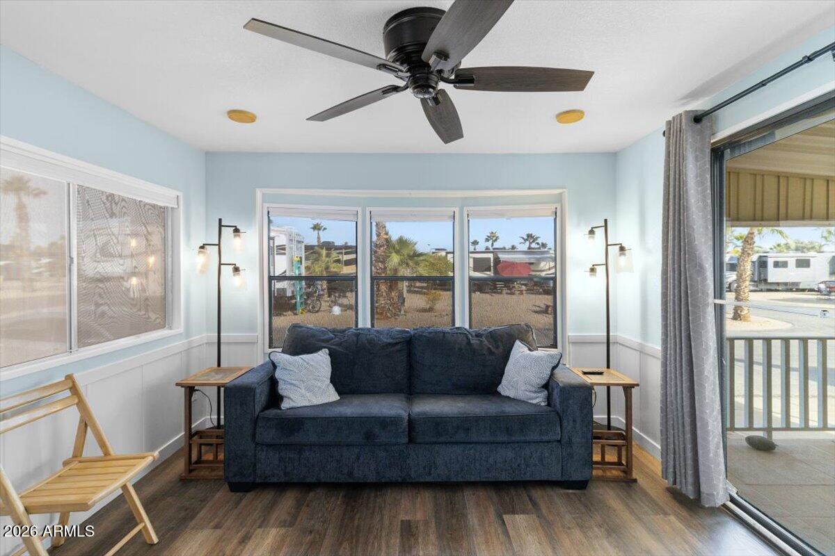 RARE LAND-OWNED LOT in Pueblo El Mirage! Own both home AND land in this highly desirable 55+ resort community. This well-maintained park model features an updated kitchen with modern finishes, beautifully landscaped yard, and convenient golf cart storage shed. Enjoy resort-style living with access to heated pool, spa, clubhouse, golf course, pickleball, tennis courts, and fitness center. Low monthly fees cover water, sewer, trash, and common area maintenance. NO HOA approval needed - fee simple ownership makes financing easy! Perfect for year-round or seasonal living in a gated community. With new features such as a water heater, light fixtures and appliances. Don't miss this rare opportunity to own one of the few land-owned lots available!
