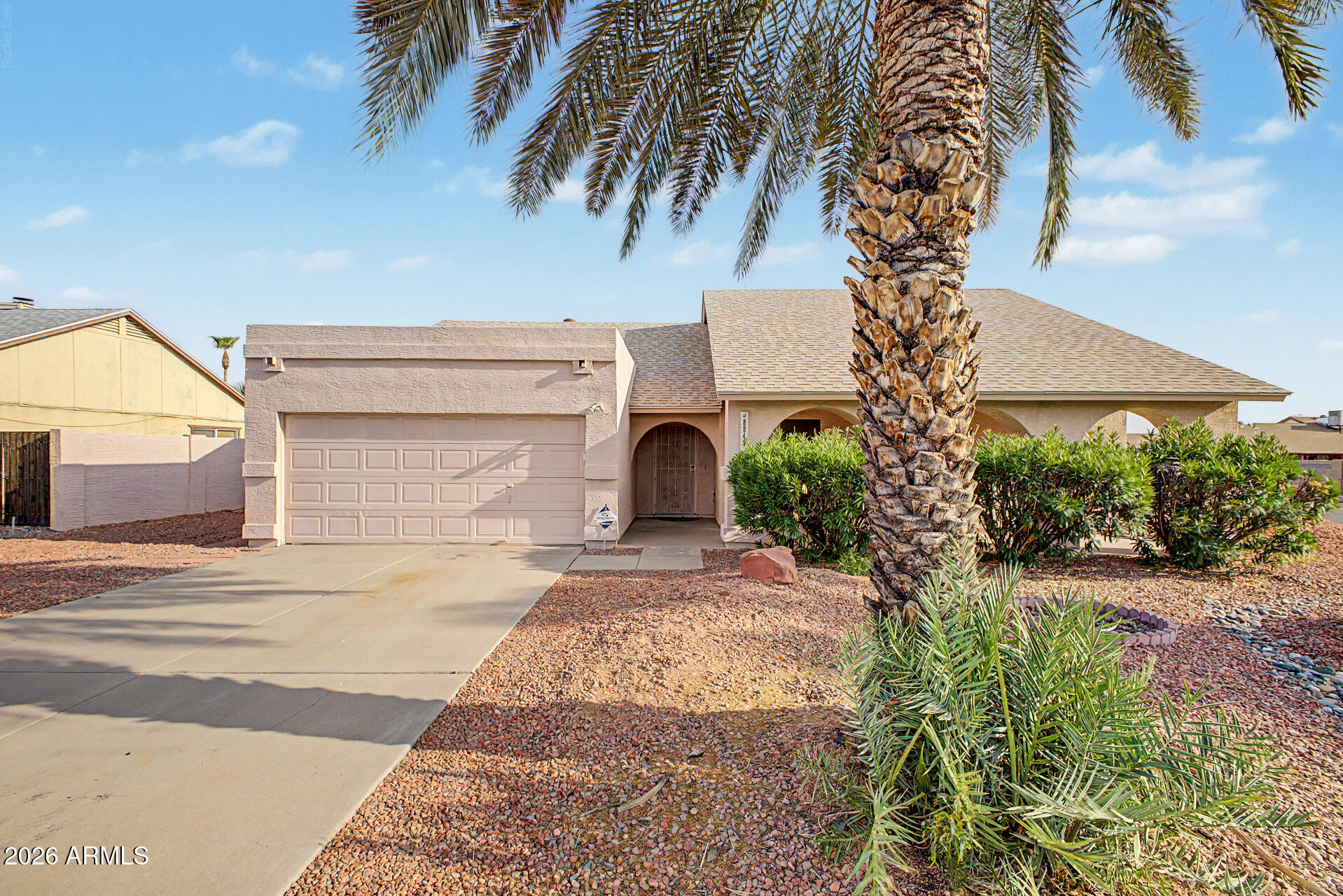 SINGLE STORY - CORNER HOME - NEWER ROOF - NO HOA Well cared for home with easy maintenance landscaping. This home is ready to move in. Inside you'll find vaulted ceilings, a spacious great room with wood-burning fireplace, ceramic tile in the main living areas and a desirable split floor plan. The kitchen offers plenty of cabinetry, pantry, generous counter space and all the appliances including the refrigerator.  Large owner's suite with more vaulted ceilings, walk in closet and wood floors. Other bedrooms boast walk in closets and ceiling fans too. Climate controlled Arizona room includes bar and hobby room. Backyard includes a large extended patio, durable shed and mature trees. Pool was filled in but decking is still intact. Future pool for you?