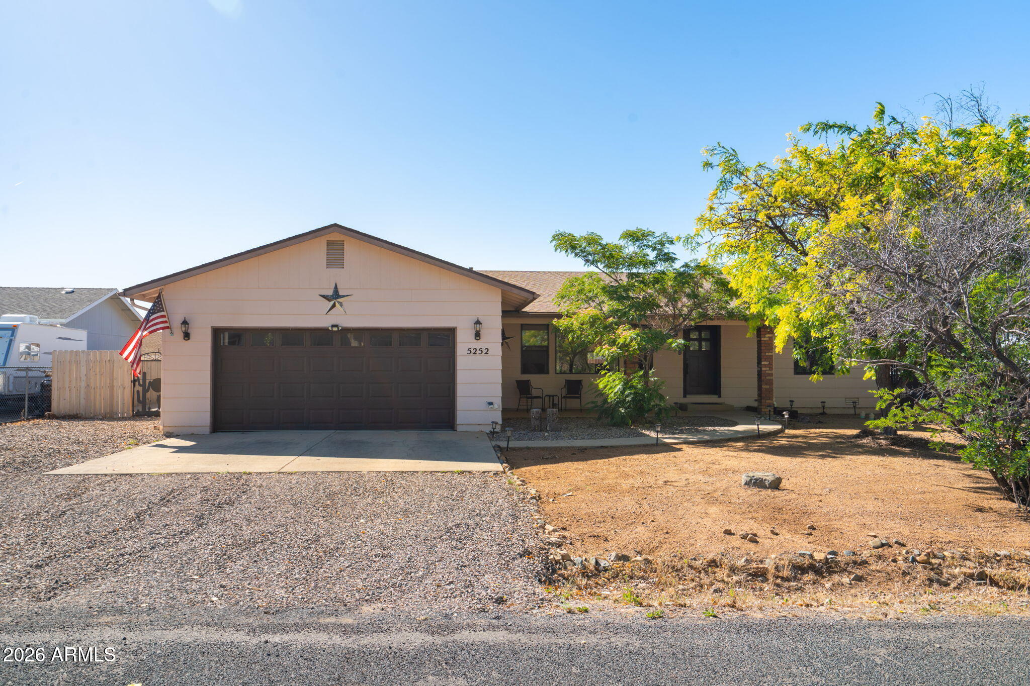 Welcome to this beautifully maintained 3 bedroom, 2 bathroom home offering 1,636 sq ft in the heart of Prescott Valley with no HOA! Designed for comfort and functionality, the split floor plan provides privacy while the spacious living and dining areas create an inviting atmosphere for everyday living and entertaining. The updated kitchen features granite countertops, a farmhouse sink, updated appliances, and ample cabinetry. Ceiling fans throughout every room--including the garage--enhance year-round comfort. Recent upgrades include a new roof and water heater. Enjoy the fully fenced backyard with a covered patio, expansive concrete patio area, RV pad, and two custom hand-built metal gates, including an RV gate. Conveniently located near shopping, dining, and local amenities!