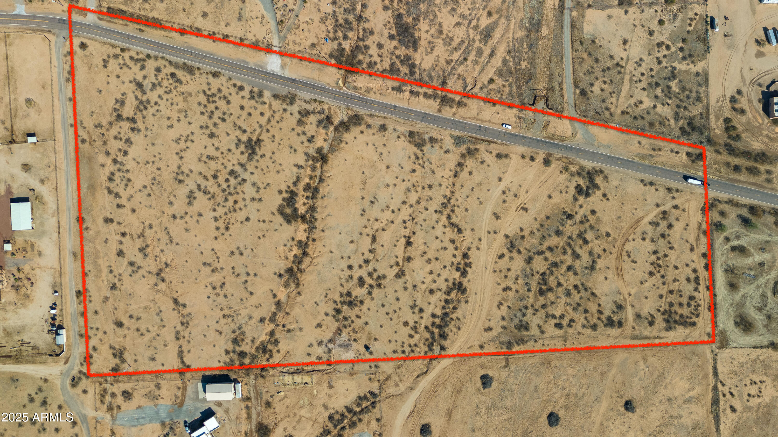 HUGE PRICE REDUCTION!! Looking for a place to take your boots off and enjoy the sunshine? Welcome to your 16 plus acre horse property located in the Team Roping Capital of the World! This prime location offers stunning mountain views to the north and the south providing a picturesque background for your daily life. Located right on the paved road, this property is easy to get to and can be split multiple times. With a newly drilled oversized well generating 25 gpm, you have the potential to support multiple homes. Current owner has a fencing permit in hand to fence the whole property that can be done for you for an additional cost. Don't wait on this one, this versatile land offers endless developement opportunities for any buyer.