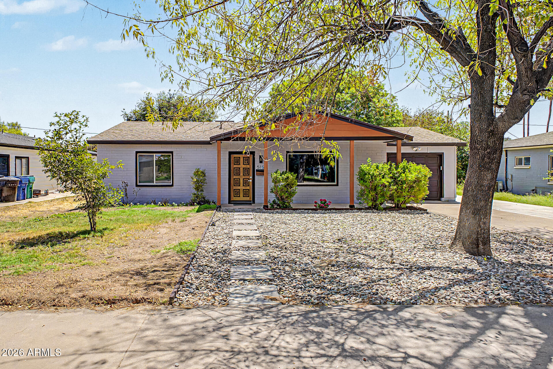 Remodeled + no HOA + irrigated single-level home with newer HVAC & roof + new paint inside & out! Offers 3 beds, 2 baths, mature landscape, irrigation front and back and a 1-car garage. The highly updated interior showcases a sleek, modern feel! Enhanced by a neutral palette, tons of natural light, new light fixtures, new doors, and new wood-look tile flooring throughout. You'll love the seamlessly flowing living & dining room! The renewed kitchen boasts SS appliances, black quartz counters, white shaker cabinetry and a breakfast bar. Perfectly sized bedrooms with closets, with the main bedroom having an ensuite with newer fixtures. Laundry room with cabinets, AC, and washer & dryer included. Check out the spacious backyard with a gazebo, shade tree, large storage shed and natural grass!