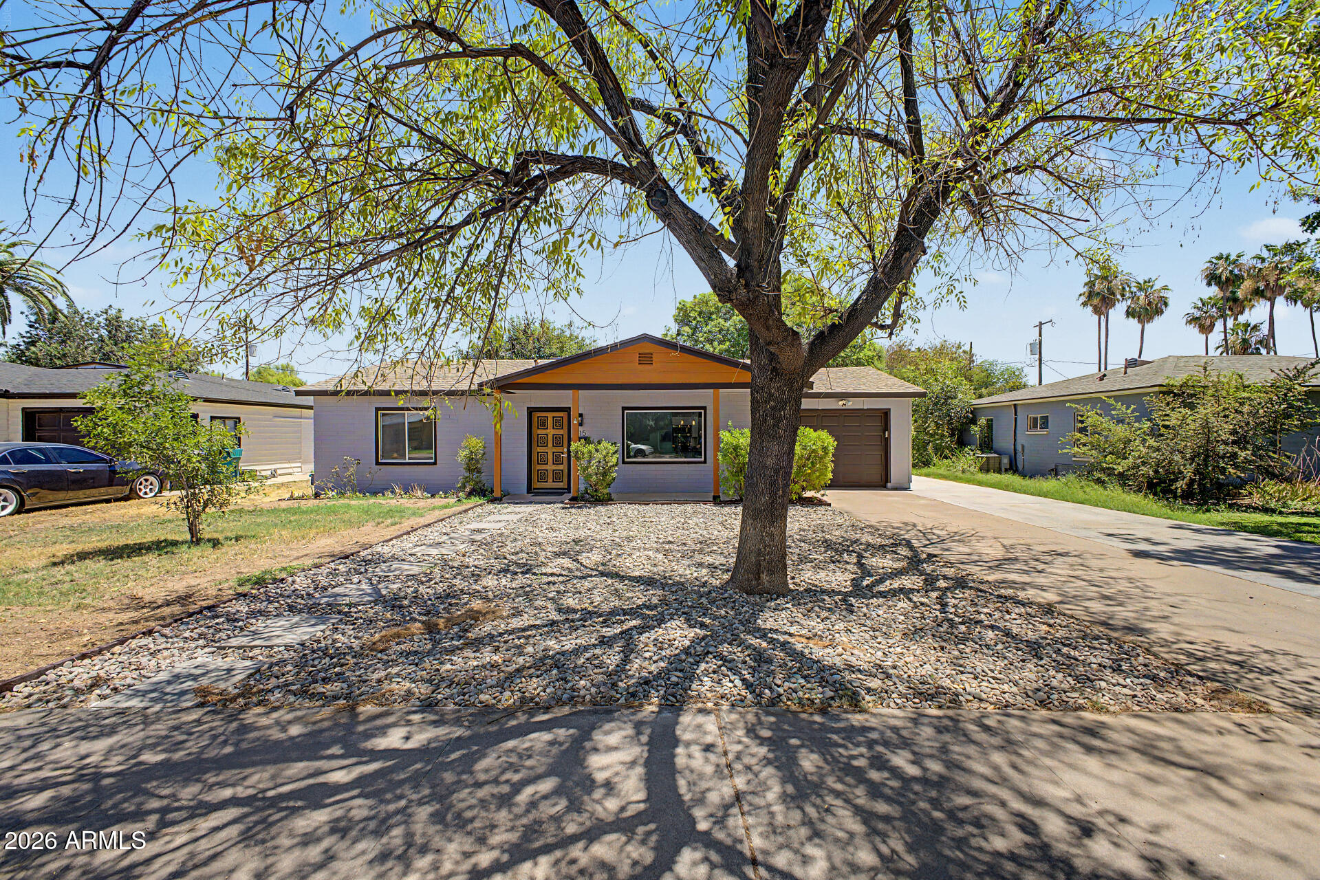 Remodeled + no HOA + irrigated single-level home with newer HVAC & roof + new paint inside & out! Offers 3 beds, 2 baths, mature landscape, irrigation front and back and a 1-car garage. The highly updated interior showcases a sleek, modern feel! Enhanced by a neutral palette, tons of natural light, new light fixtures, new doors, and new wood-look tile flooring throughout. You'll love the seamlessly flowing living & dining room! The renewed kitchen boasts SS appliances, black quartz counters, white shaker cabinetry and a breakfast bar. Perfectly sized bedrooms with closets, with the main bedroom having an ensuite with newer fixtures. Laundry room with cabinets, AC, and washer & dryer included. Check out the spacious backyard with a gazebo, shade tree, large storage shed and natural grass!