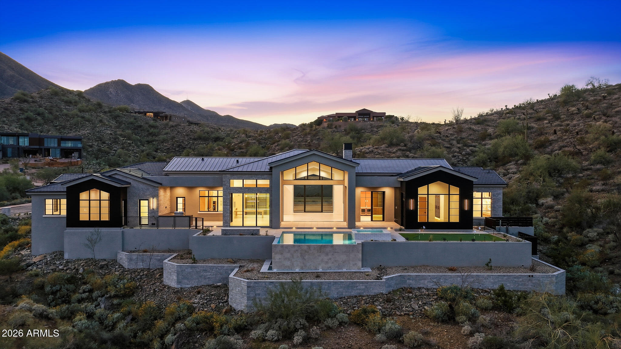 Gurczak Luxury Development is proud to present this New Construction Transitional Modern Home Nestled in the Exclusive Guard Gated Community of Eagles Nest. The orientation of the home focuses toward the view corridor towards the Fountain and Superstition Mountains to the Southeast. This 5,281 Sq. Ft. Home Features 5 Bedrooms w/ 4 ensuite bathrooms, a separate powder room + Game Room. Oversized Temperature Controlled 4 Car Garage has ample space for all your toys and includes bonus storage & workshop area. Home completed March 2026.
