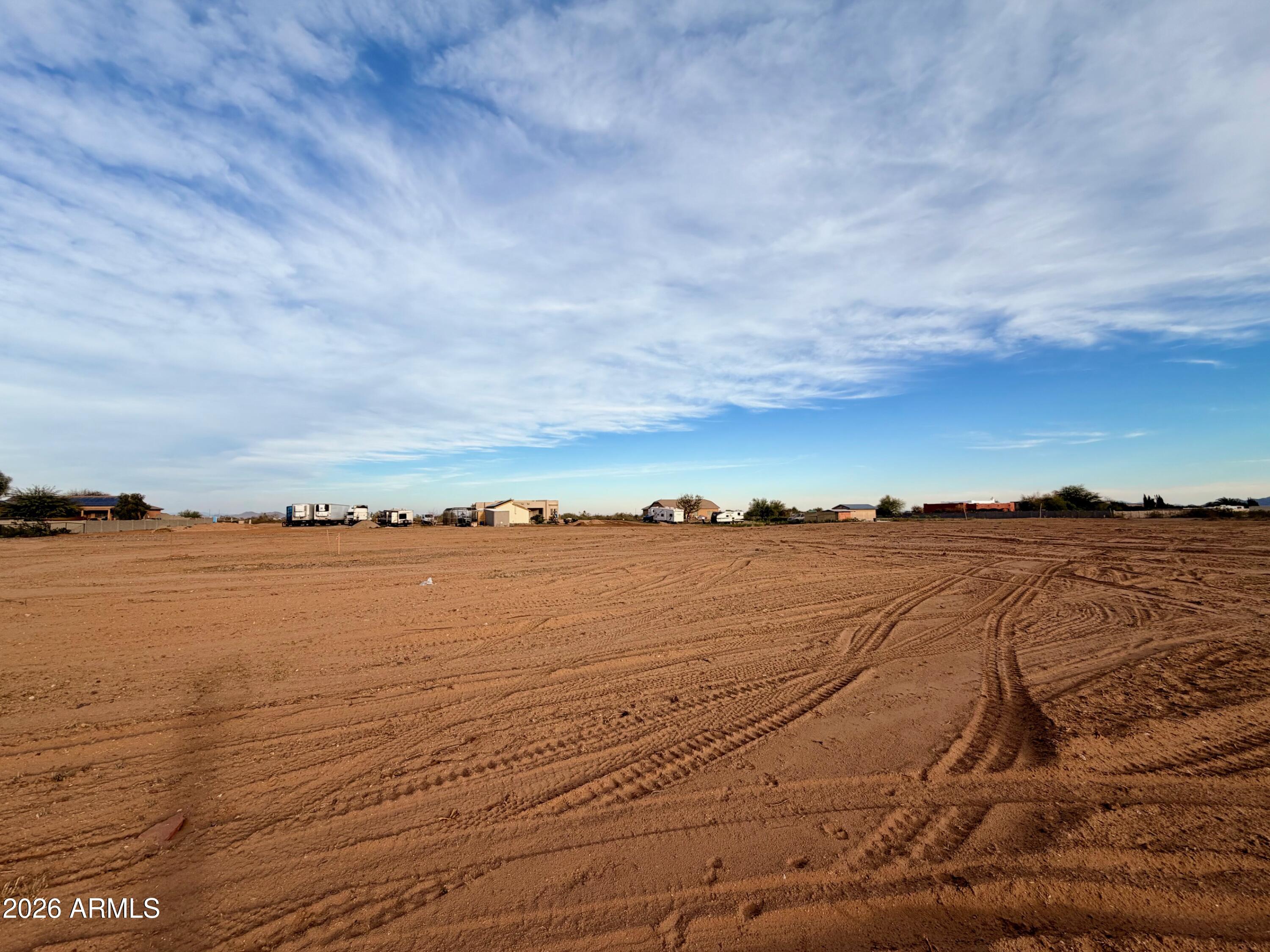 UP TO FIVE, ONE-ACRE LOTS AVAILABLE! Exceptional lots, cleared and ready to go in the quiet community of Wittmann. NEW SHARED WELL (INSTALLED APRIL 2026). Electric at lots. No Luke AF APZ. Surrounded by new custom homes/ranches. Room for spacious home PLUS RV garage PLUS guesthouse PLUS horses and all the toys. No HOA. Improved road and shared easement to parcels. EZ access to US60/Grand, the 303, Lake Pleasant, Shopping, Dining, and a quick trip to Vegas. Buyer to verify all info. Septic will be needed. Seller may carry, ask for terms. Multiple lots available. Great opportunity for builder.