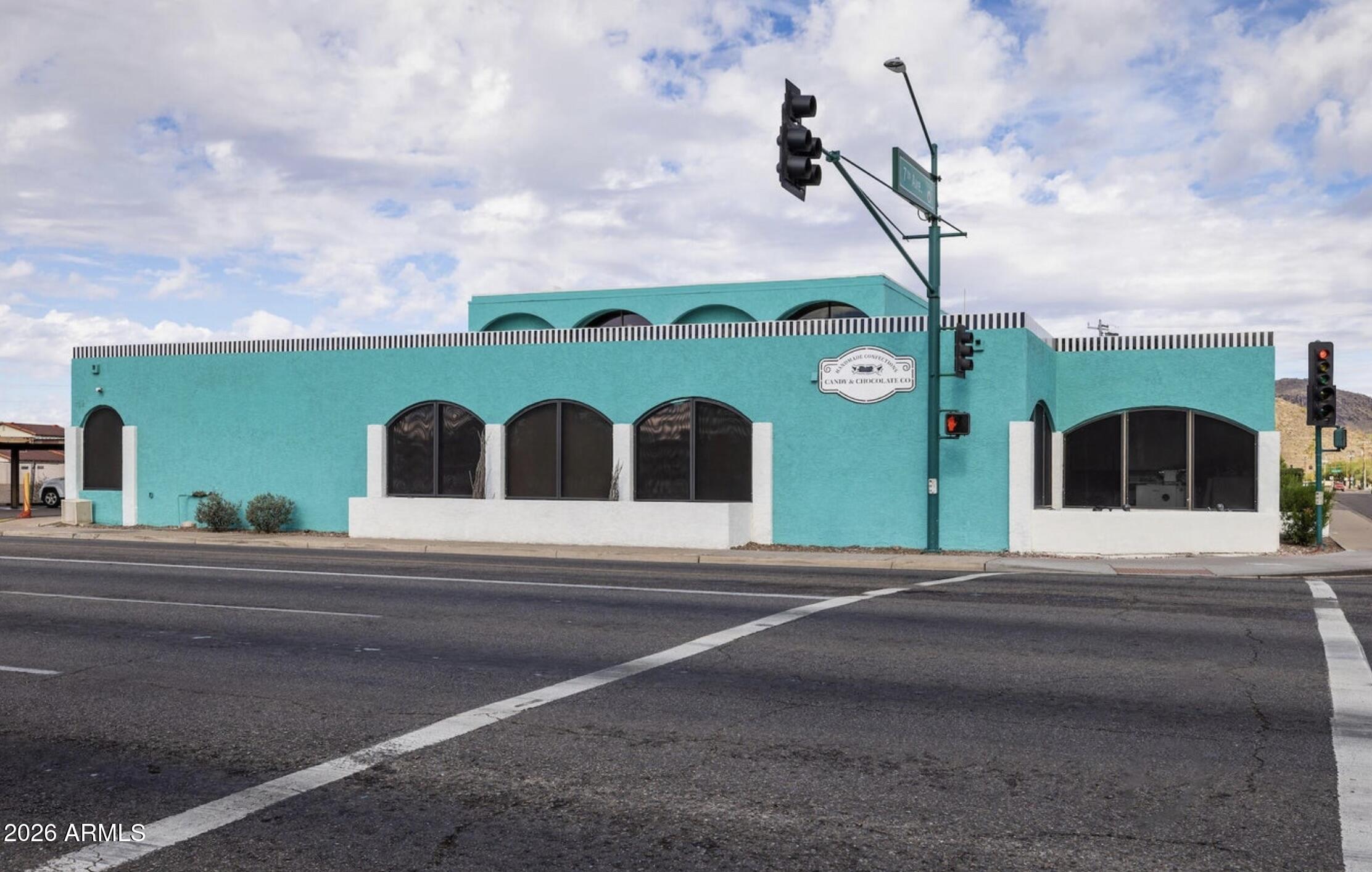 Prime Commercial Investment Opportunity in Sunny Slope.

Exceptional corner-lot commercial property located in the highly desirable Sunny Slope neighborhood at the intersection of 7th Avenue and Dunlap Avenue. Positioned in the path of growth with numerous new developments nearby, this versatile mixed-use building offers both immediate income and future upside.

The property features two existing retail spaces, three kitchen/prep areas, two public restrooms, and two private restrooms on the ground floor, providing flexibility for a variety of commercial uses including retail, catering, food production, or specialty service businesses. The second floor includes four private offices and an additional private restroom, making it ideal for administrative, professional, or creative work spa The building currently benefits from two established tenants with leases in place, generating immediate rental income. Existing tenants include a wholesale candy distributor and a retail candy store that has recently undergone significant upgrades and improvements.

Additional highlights include excellent visibility, strong street presence, easy access, and abundant covered and uncovered parking for customers, employees, and tenants. The corner location offers outstanding exposure in one of North Phoenix's most recognizable commercial corridors.

Whether you're an investor seeking stable cash flow or an owner-user looking for a strategic location with supplemental rental income, this property presents a rare opportunity in a rapidly growing area.
Contact us today for additional information and a private tour.