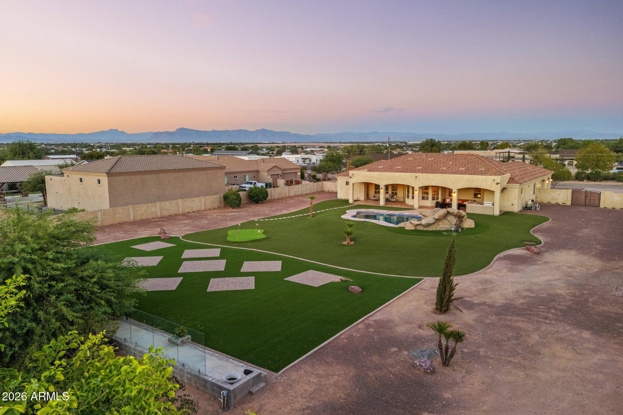 : MOUNTAIN VIEWS! BEAUTIFUL CUSTOM HOME on ACRE+ lot located on the boarder of Gilbert/Queen Creek w/RV GATE & NO HOA*Low maintenance front/backyard w/turf & circular driveway*Resort style back includes pebble tech pool with slide, grotto, & spill over spa, built in grill/bar, extended patio length of house, pavers perfect for entertaining large parties, putting green, plenty of space for a future workshop/RV garage/ADU/Batting cage....options are endless*Gourmet kitchen offers top of the line Matte Black appliances & matching hood, large single bowl sink, white shaker cabs, granite slab, pantry, 2 islands one w/veggie sink, all open to the family room*Spacious main suite offers private exit to patio free standing tub, beautiful tiled shower w/dual shower heads, giant walk in closet *En-Suite w/walk in closet & private exit to patio*Oversized bedroom 4*Walk in closet in bedroom 3*Full baths with floor to ceiling tiled showers*Bonus room perfect for formal dining or office*3+ car garage features epoxy flooring, utility
sink & water softener*Custom shutters throughout*Custom iron door & private iron gated entrance*County island lot*Close to
highly rated schools including ALA, Ben Franklin, Queen Creek, Casteel, Crimson and more! Minutes to shopping, Mesa Gateway Airport, & restaurants! Lots of entertainment nearby such as Fat Cats, San Tan Flat, Golf, Horseshoe Park & Equestrian Centre, Schnepf Farms, Olive Mill, Aquatic Center, Veterans Oasis Park, Mansel Park, & Arizona Athletic Ground*