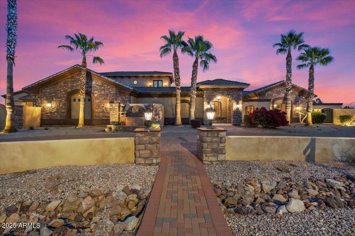 Luxurious 10,000 Sq. Ft. Estate with Resort-Style Backyard & Stunning Mountain Views

Step into unparalleled luxury with this stunning 10,000 sq. ft. estate, where designer details and modern upgrades elevate every corner. A paver half-moon driveway, complemented by new landscape lighting and front irrigation, sets the tone for this grand residence.

Inside, custom stone veneer accents, fresh upgraded paint, and handcrafted black metal lighting create a sophisticated ambiance. The chef's kitchen is a masterpiece, featuring a 6-burner gas cooktop, brand-new Bosch dishwasher, and stone veneer accents.

Entertain effortlessly with a walk-in wine cooler that holds 3,000 bottles, a private movie theater with a 130-inch screen and plush reclining chairs. Amazing game room with a bar area, wainscoting details throughout, bathroom,...the game room can be converted back to a bedroom, has its own HVAC...   makes it a perfect guest quarters.

The primary suite is a sanctuary, offering a sitting area, a three-way fireplace, expansive walk-in closets, and direct access to the backyard oasis. Each of the 6 bedrooms is an ensuite, ensuring comfort and privacy, plus two additional half baths.  THE 6TH BEDROOM IS BY THE FRONT DOOR.  HAS BEEN CONVERTED TO THE GAME ROOM

Outdoor living reaches new heights with a resort-style pool featuring a Baja step, fire bowls, tranquil courtyards, multiple water features, and balconies showcasing breathtaking mountain views. A dedicated workout area, executive office with built-ins, and an impressive 12-car garage with RV storage complete this one-of-a-kind estate.

This home is truly a must-seean extraordinary blend of elegance, comfort, and entertainment