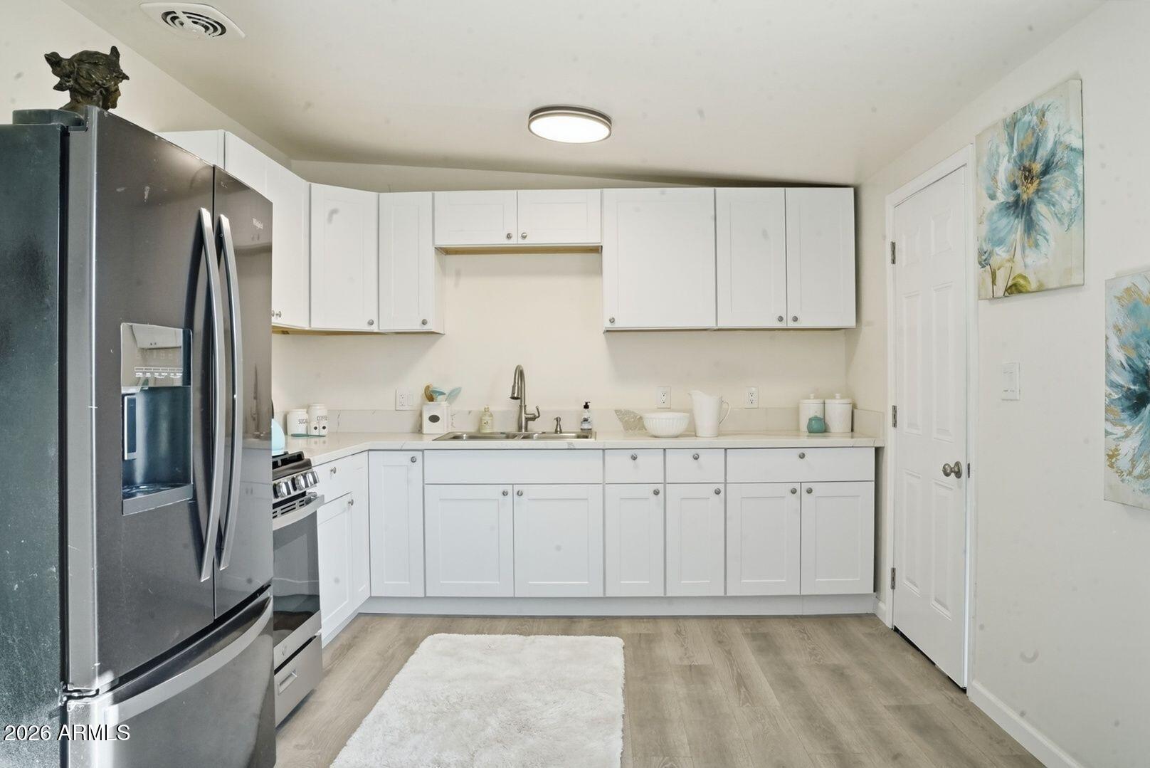 This professional remodel transforms a spacious 3
bedroom, 1 bathroom home in Kearny, AZ, into a modern, functional, and stylish living space. The renovation includes a complete overhaul of the interior, featuring upgraded flooring, fresh paint, and modern fixtures throughout. The kitchens and bathrooms have been updated with new cabinets, countertops, and fixtures, enhancing both aesthetics and efficiency. The bedrooms have been refreshed with new lighting. Energy-efficient windows and HVAC systems improve comfort and reduce utility costs. The exterior has been revitalized with new siding, landscaping, and driveway improvements, boosting curb appeal. This remodel blends practicality with contemporary design!