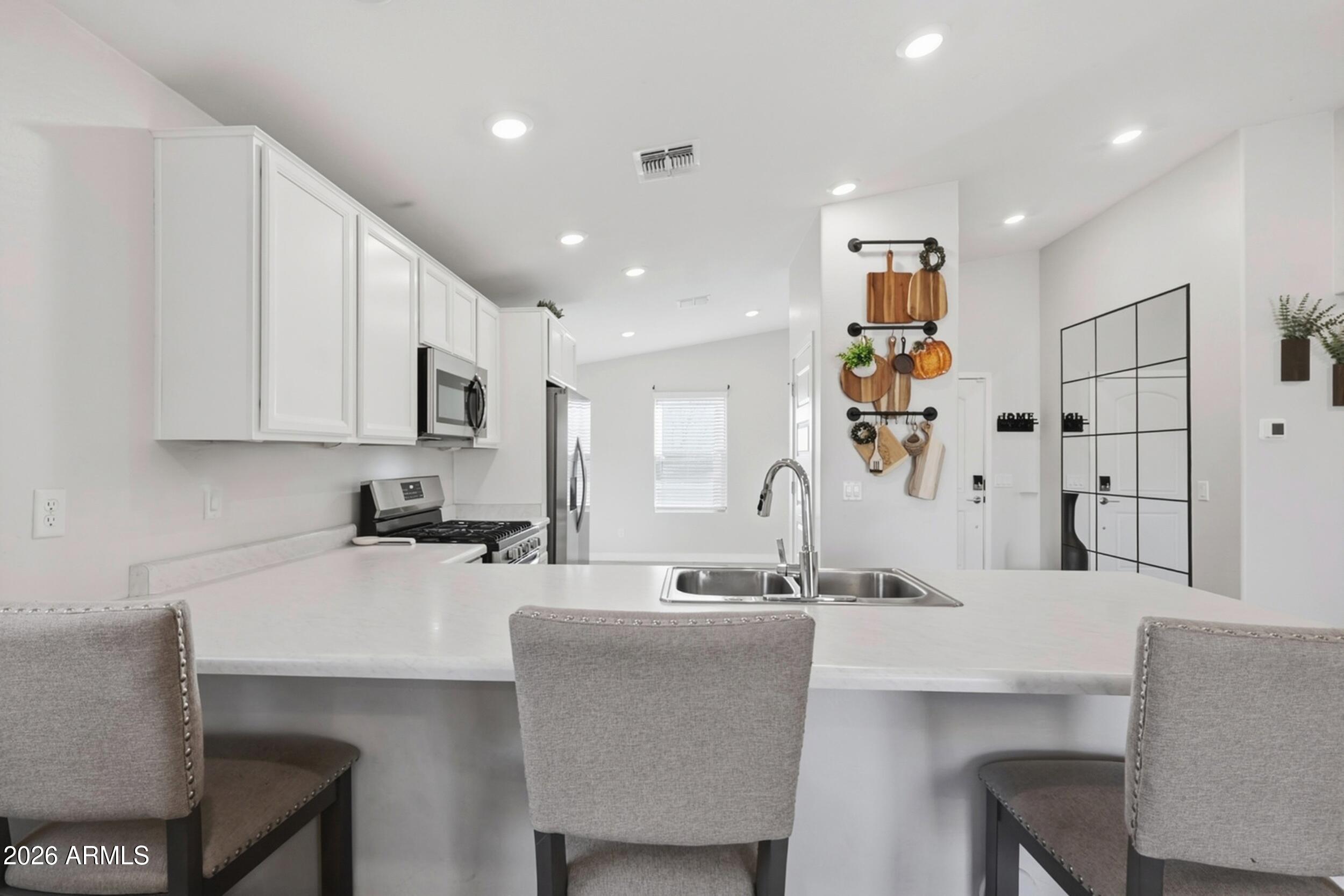 Beautifully updated 3-bed, 2-bath single-level home in a convenient Tolleson location! This move-in ready property features an open living concept, a modern kitchen with stainless appliances, sleek countertops and ample cabinetry. The spacious primary suite offers a relaxing retreat with a private bath. Enjoy low-maintenance living with a generous backyard perfect for outdoor gatherings, gardening, or future upgrades. Close to shopping, dining, schools and easy freeway access, ideal for first-time buyers, investors. Don't miss this opportunity to own a well-cared-for home in a great community!