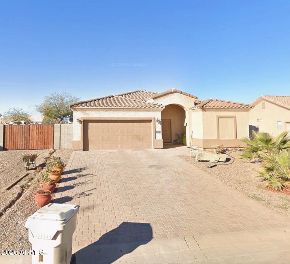 3 Bedroom Home - Across from the Golf Course! Offering 1,600 sq. ft. of thoughtfully designed living space. The island kitchen is a true highlight, featuring two pantries, stainless steel appliances, built-in microwave, sleek stainless steel counters, and a convenient breakfast bar. Gorgeous tile flooring flows through the main living areas, with comfortable carpet in the bedrooms and soaring 9-foot ceilings throughout. You'll also appreciate the abundant recessed lighting, ceiling fans. The primary suite offers a double vanity, stunning tiled walk-in shower with glass doors, and a spacious walk-in closet complete with built-in shelving. The secondary bathroom also includes a beautiful tile surround. Additional features include energy-efficient spray foam insulation, a tile roof, block fencing, 2-car garage, a cobblestone driveway, an a RV gate with RV parking,