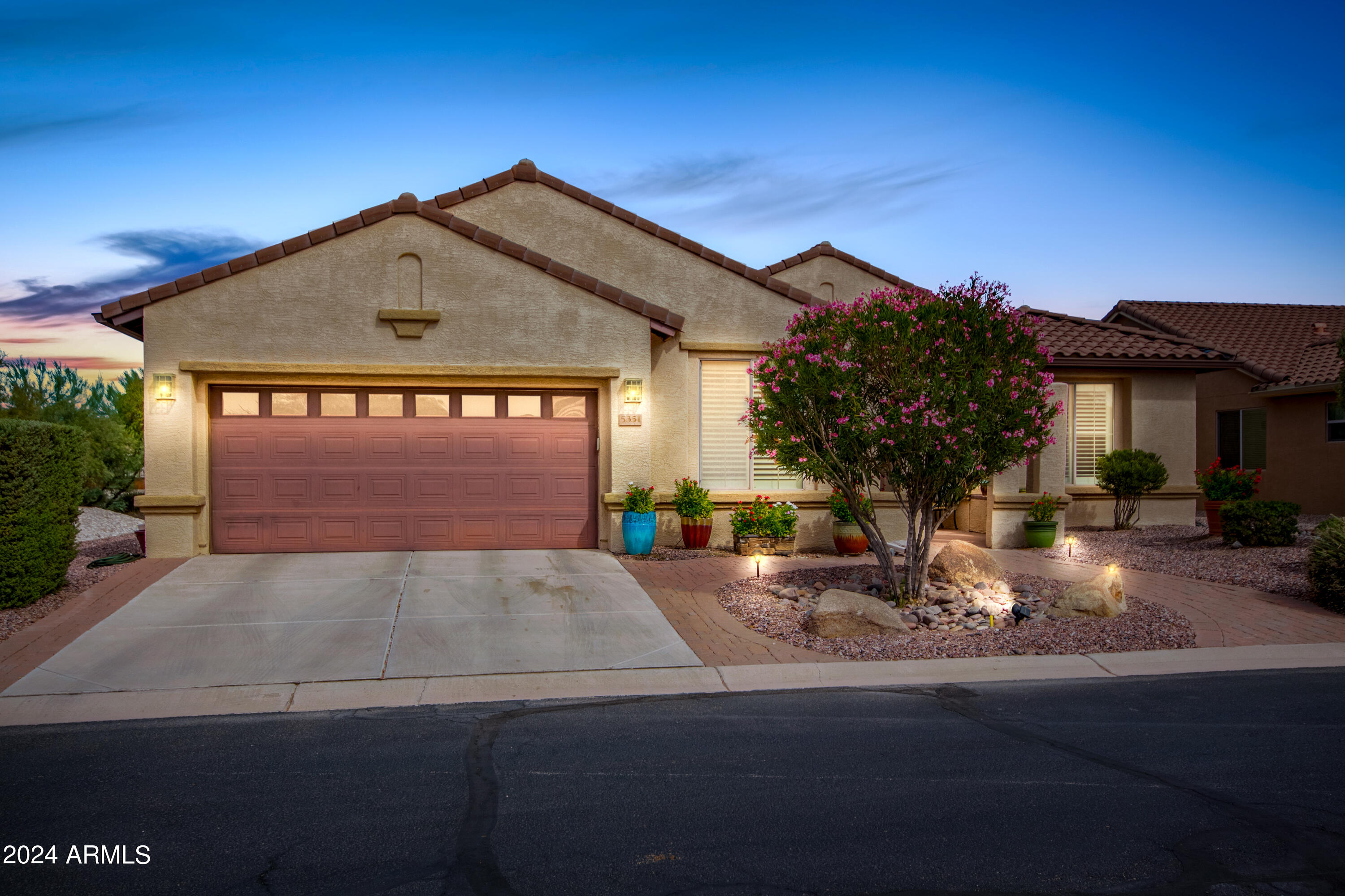 NEW EXTERIOR PAINT (SEPT 2025) This best-value Talavera Model, built with durable Integra Block construction, offers 2,530 sq ft on a beautiful North/South-facing view lot. Extended pavers lead to a private courtyard and custom knotty alder front door. Inside, enjoy tile floors, crown molding, and wood-framed windows. The kitchen boasts 42'' cabinets, granite counters, pull-out shelves, gas cooktop, touchless faucet, and new microwave. Features include 3 bedrooms, 2.5 baths, den/office, and a versatile hobby/bonus room with walk-in closet & independent AC & heat. The 2-car garage has a 4' extension, sink, and side door; golf cart conveys. Bay windows, extended patio with outdoor furniture and flowerpots, complete this stunning home.