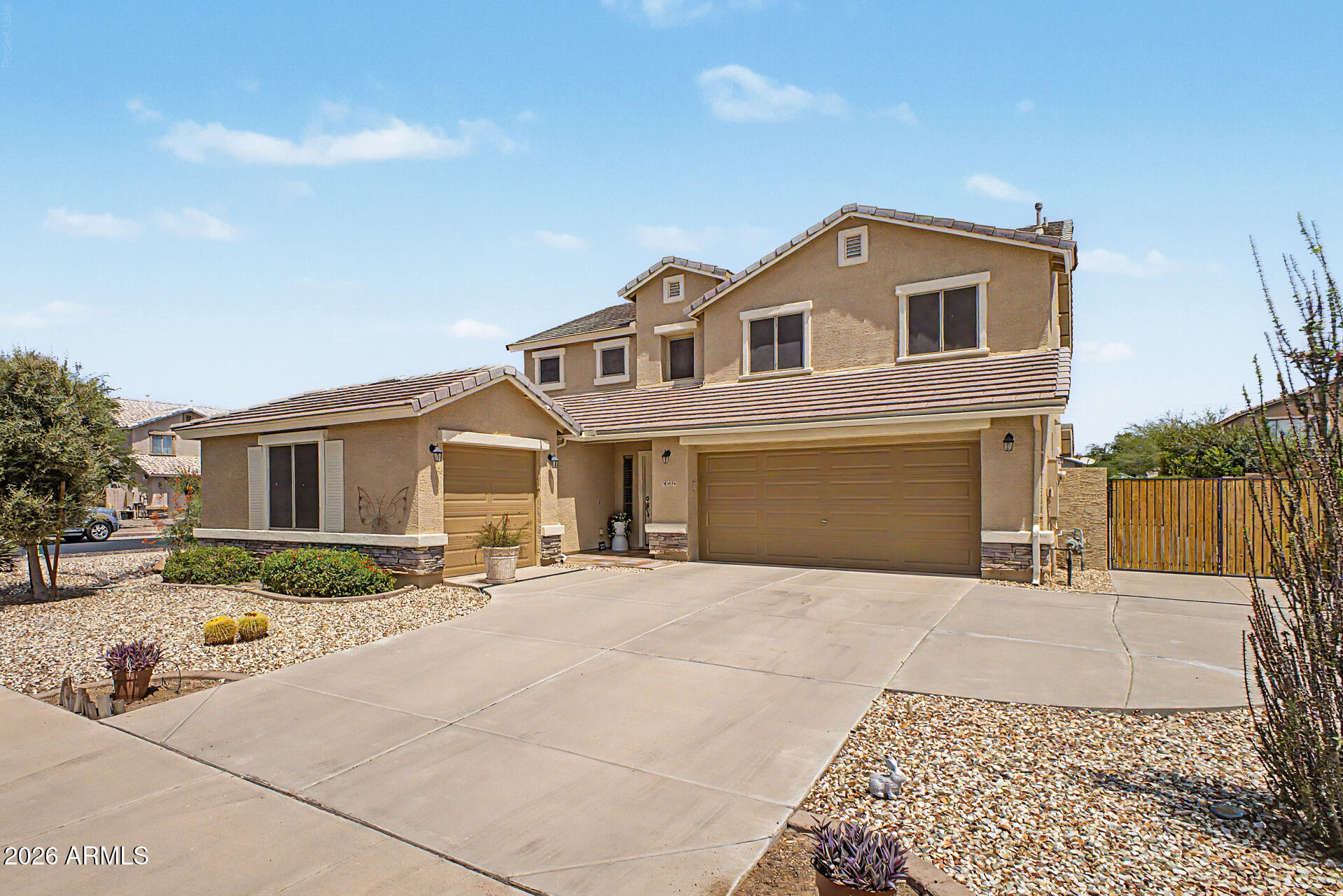 Rare opportunity on a coveted corner lot - this home was heavily renovated top to bottom in 2019 and shows like brand new! Featuring 5 spacious bedrooms and 3.5 baths with soaring ceilings and abundant natural light throughout. A generous guest bedroom downstairs with a full bath offers convenience for visitors or multi-gen living. Warm color tones flow throughout, complementing any design style! The huge formal living/dining room is an entertainer's dream, perfect for gatherings of 2 or 20! The chef's kitchen will not disappoint, boasting custom cabinets, granite counters, stainless steel appliances, pull-outs, spice rack, lazy susan, double ovens, built-in microwave, refrigerator, pantry, recessed lighting, and overhang lighting at the breakfast bar. Step inside to find a spacious family room, the perfect relaxation headquarters, while a large under-stairwell closet adds valuable storage. The inside laundry room offers built-in cabinets and extra storage, conveniently located next to the powder room. An attractive wrought-iron and wood banister leads upstairs to 4 additional bedrooms with generous closet space. Double doors open into the expansive Master Suite, complete with a sitting area ideal for a home office, reading nook, or exercise space, vaulted ceilings, and a ceiling fan. The luxurious master bath features dual sinks, ample cabinetry, a separate tub & shower, and a walk-in closet. All guest bedrooms include ceiling fans for year-round comfort.
The 3-car garage was fully updated in July 2026 with brand-new garage door panels and controls, offering peace of mind for years to come. It also offers a side yard access door, and an RV gate leads to an extended concrete pad with plenty of room to park all your toys! The low-maintenance backyard is an entertainer's paradise with pavers, an extended covered patio, and a BBQ area for effortless family gatherings. Meticulously maintained and updated.
